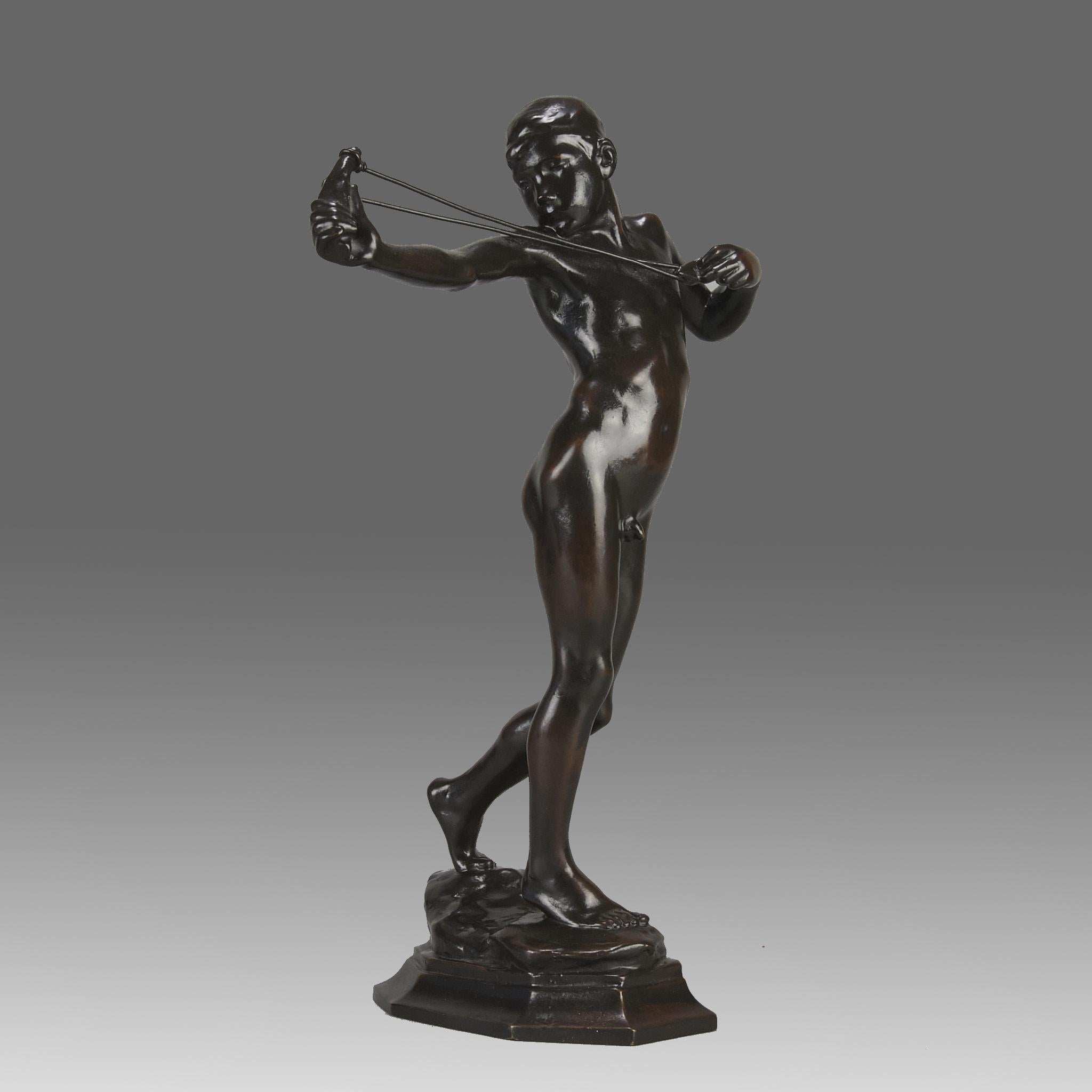 A charming and dramatic early 20th Century Art Nouveau bronze study of a standing boy aiming his catapult, signed to base. The sculpture depicts a young boy gracefully poised in the act of launching a sling. Crafted from bronze, the sculpture's