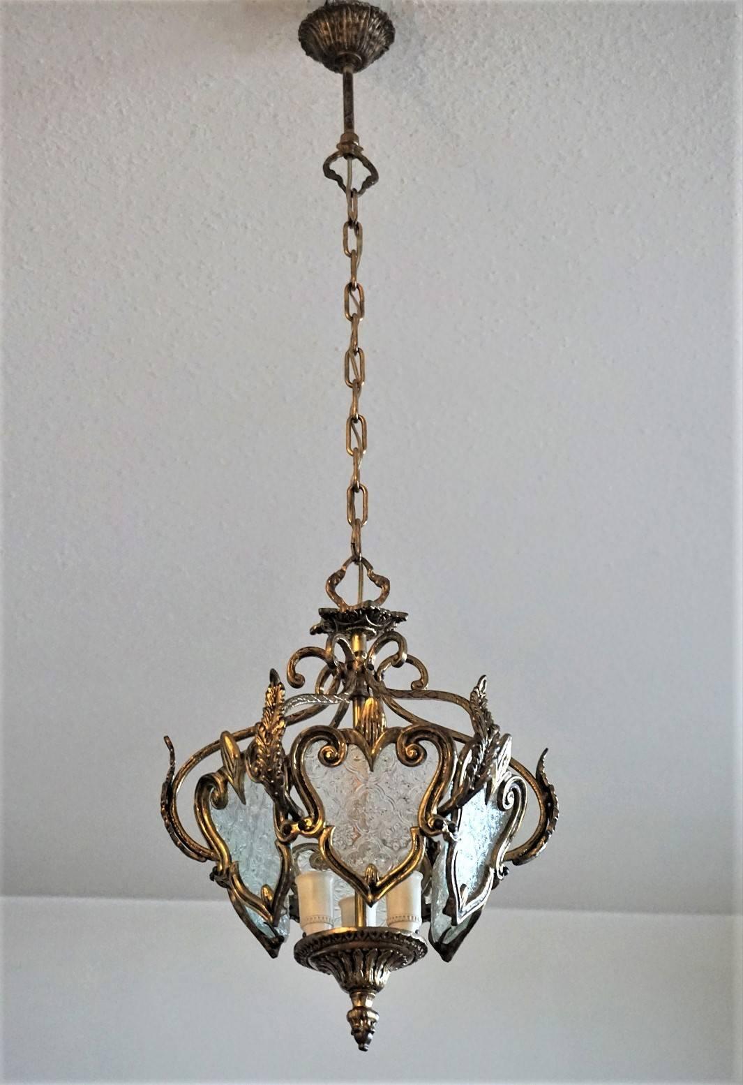 Art Nouveau style bronze three-light lantern richly decorated, six-sided with molded glass windows, circa 1930.
In very good condition, bronze with beautiful patina, on glass no chips or cracks. This piece has been cleaned and hand polished.
Three
