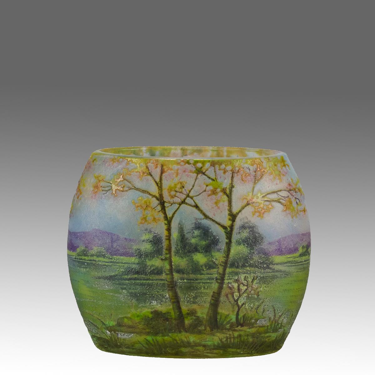 A delightful late 19th Century cameo glass vase etched and enamel painted with a beautiful landscape in the midst of summer with excellent detail and very fine colour,   Signed Daum Nancy with the Cross of Lorraine.
ADDITIONAL INFORMATION
Height:   