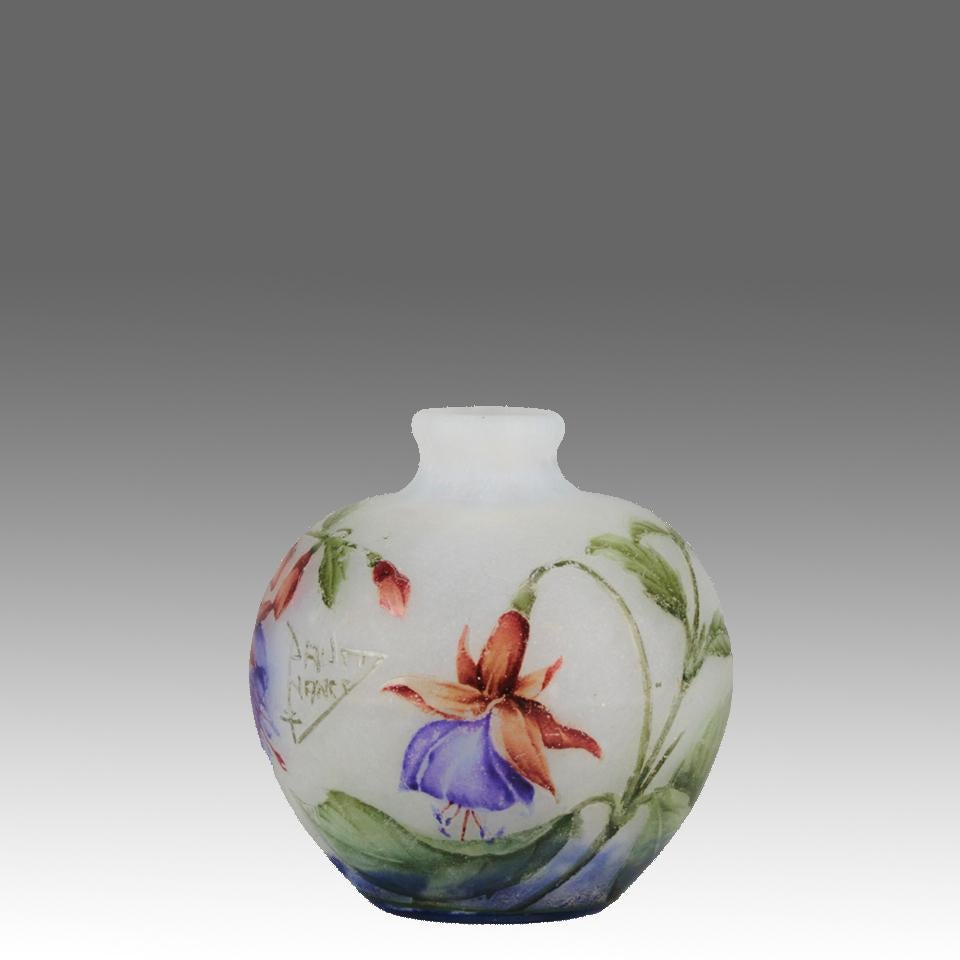 A beautiful early 20th Century cameo glass vase decorated with blooming violets against a white field with excellent colour and detail, signed Daum Nancy with Cross of Lorraine 
ADDITIONAL INFORMATION
Height:                                     6.5