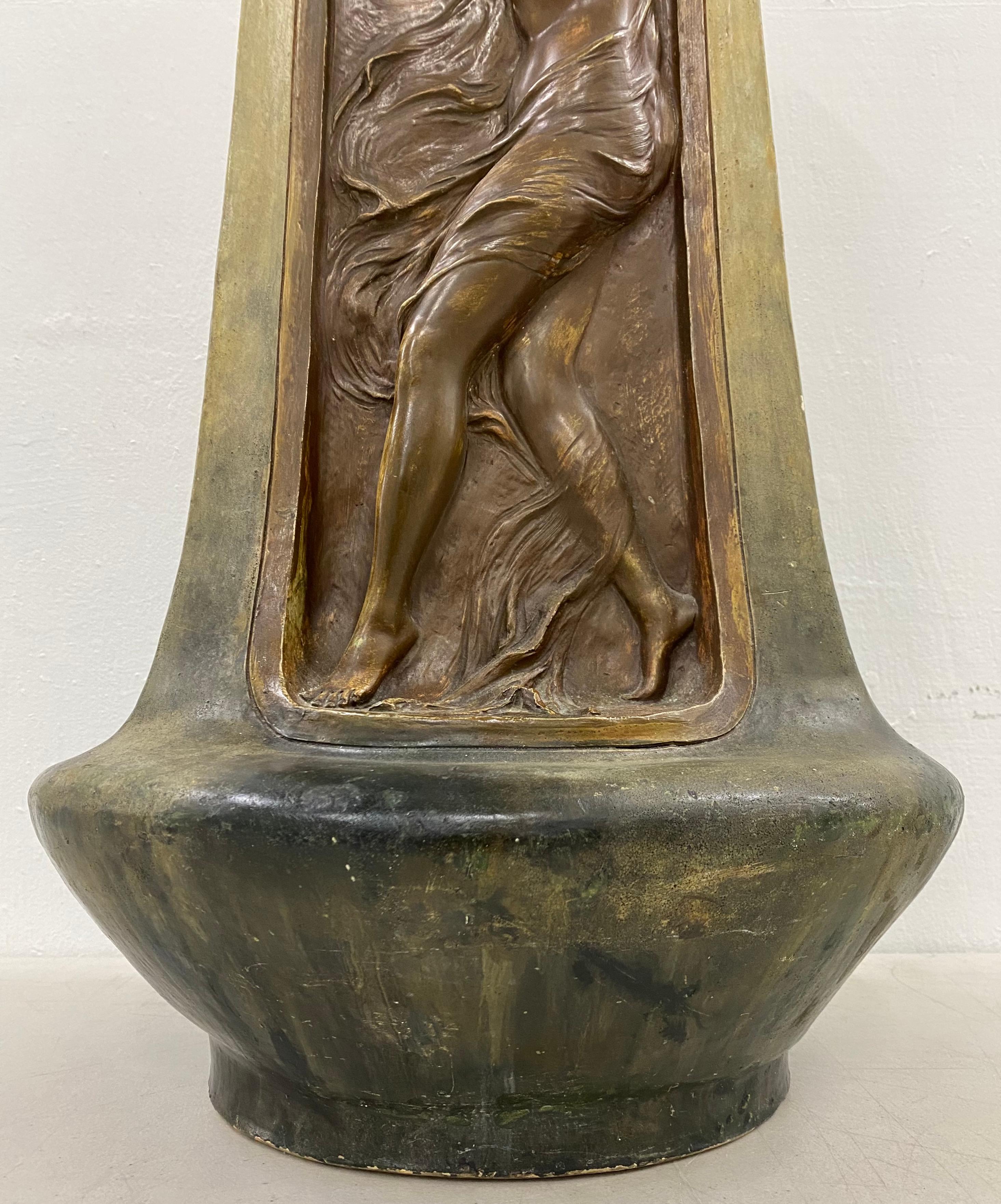 Early 20th century Art Nouveau ceramic vase, C.1910

Classic Art Nouveau vase with a young woman in billowing clothes in relief

Measures: 9.5