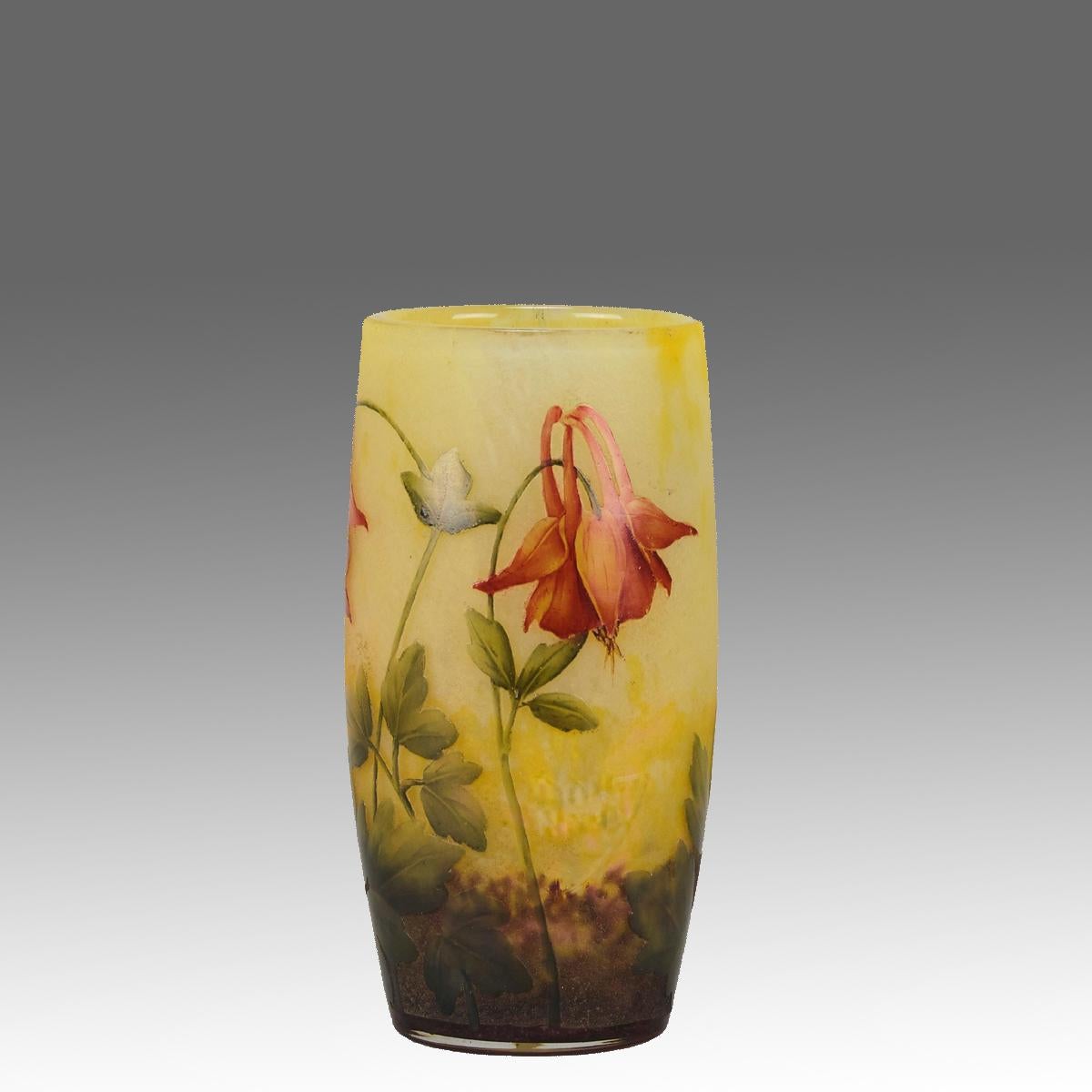 A very pretty early 20th Century Art Nouveau cameo glass vase etched and enamelled with red blooming Aquilegia flowers against a yellow field, exhibiting excellent colour and detail. Signed Daum Nancy with the Cross of Lorraine.
ADDITIONAL