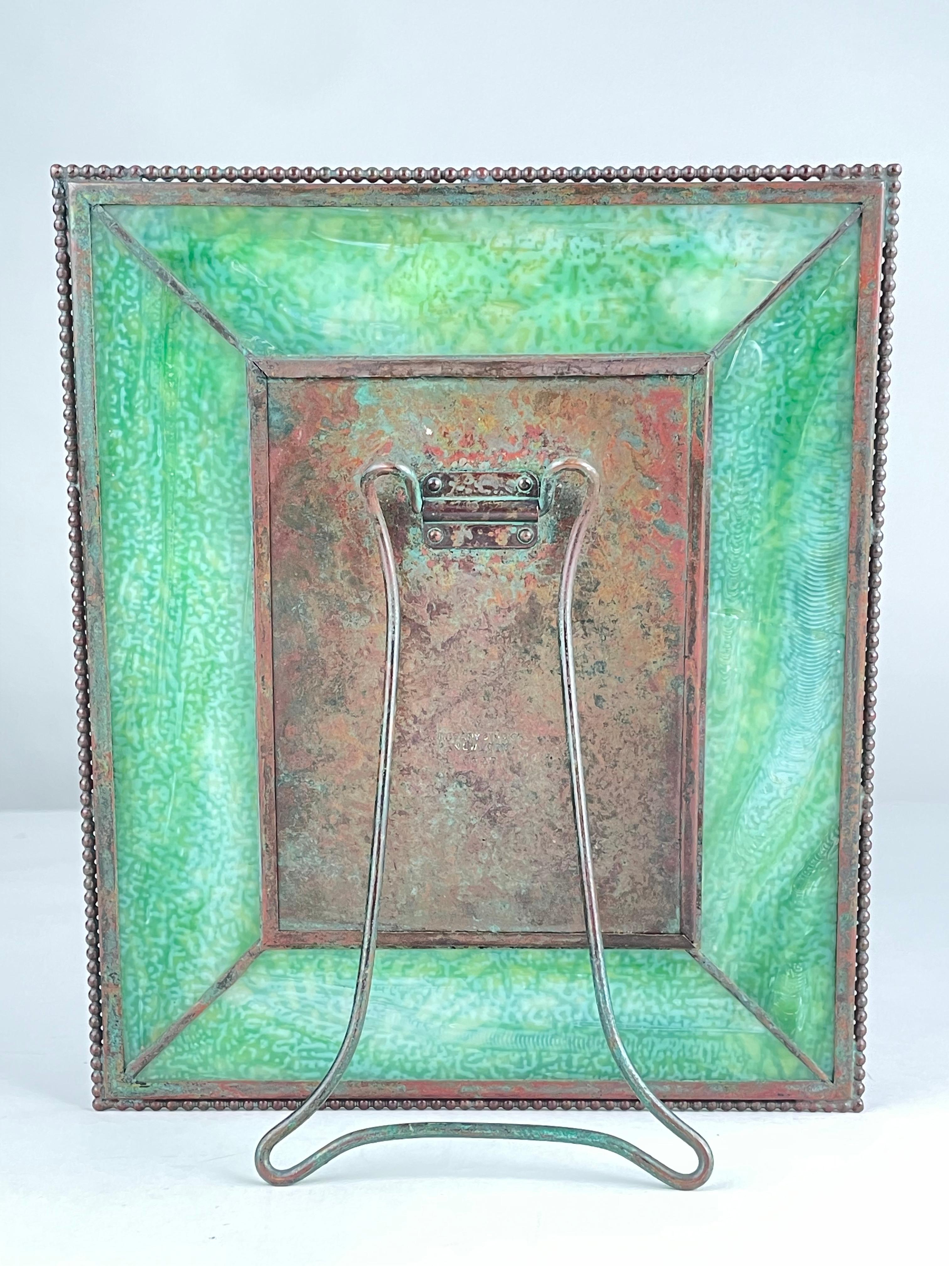 Early 20th century Art Nouveau Pine needle pattern picture frame by, Tiffany Studios decorated with its original rich red brown patinated 