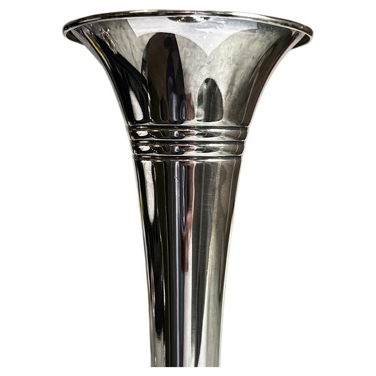 A gorgeous Art Nouveau trumpet or bud vase by Reed & Barton. This piece is in remarkable condition for its age. It is quite heavy which made us question whether it was silver plate or sterling silver. It would be lovely on a nightstand or dressing