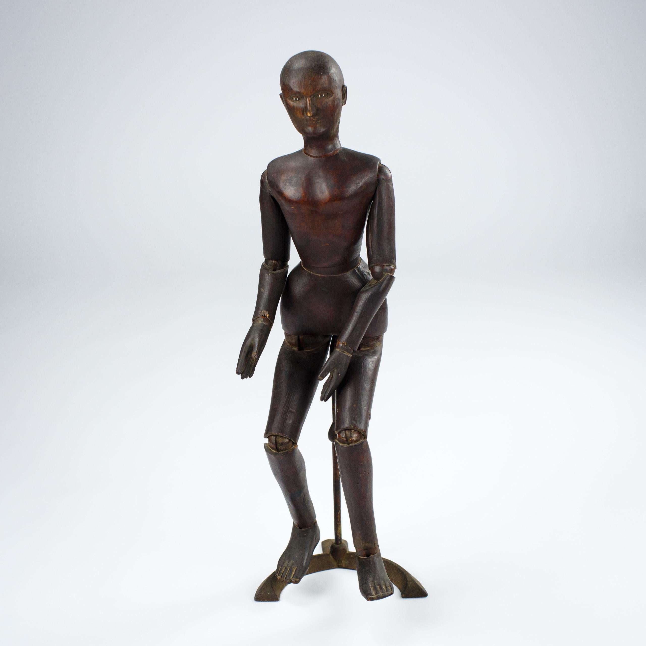 Good size late 19th or Early 20th Century Artist Lay figure or mannequin, with original telescopic stand. Carved wood, each joint pose able for the artist to capture the human form. Carved Facial features as well as detail to the fingers and toes.