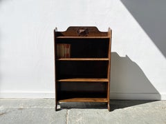 Early 20th century Arts and Crafts oak book shelves