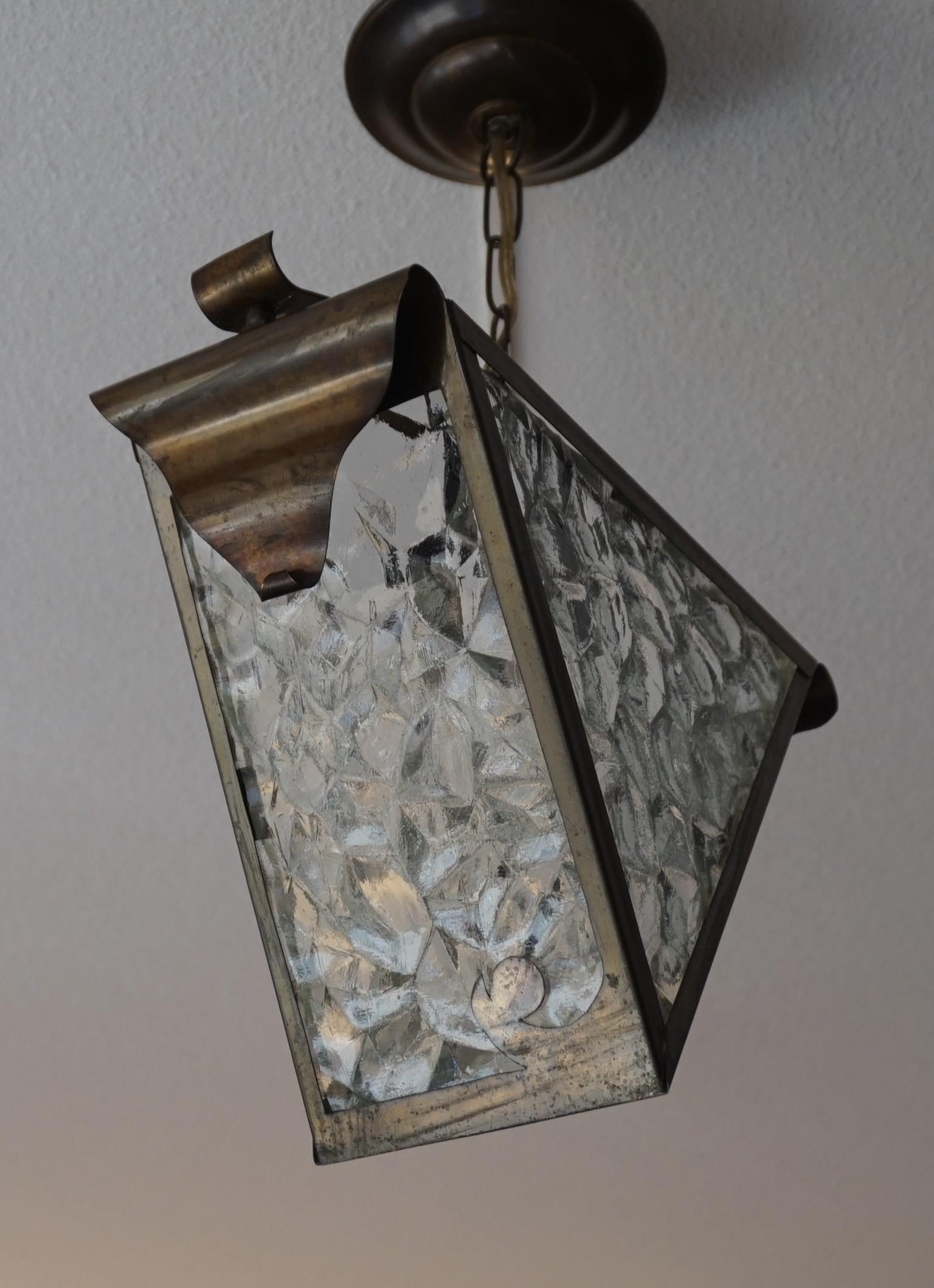 One of a kind, triangular Arts & Crafts ceiling lamp.

If you are looking for a unique Arts & Crafts pendant to grace your hallway, bedroom or perhaps a landing then this all handcrafted specimen could be perfect for you. The fully handmade,