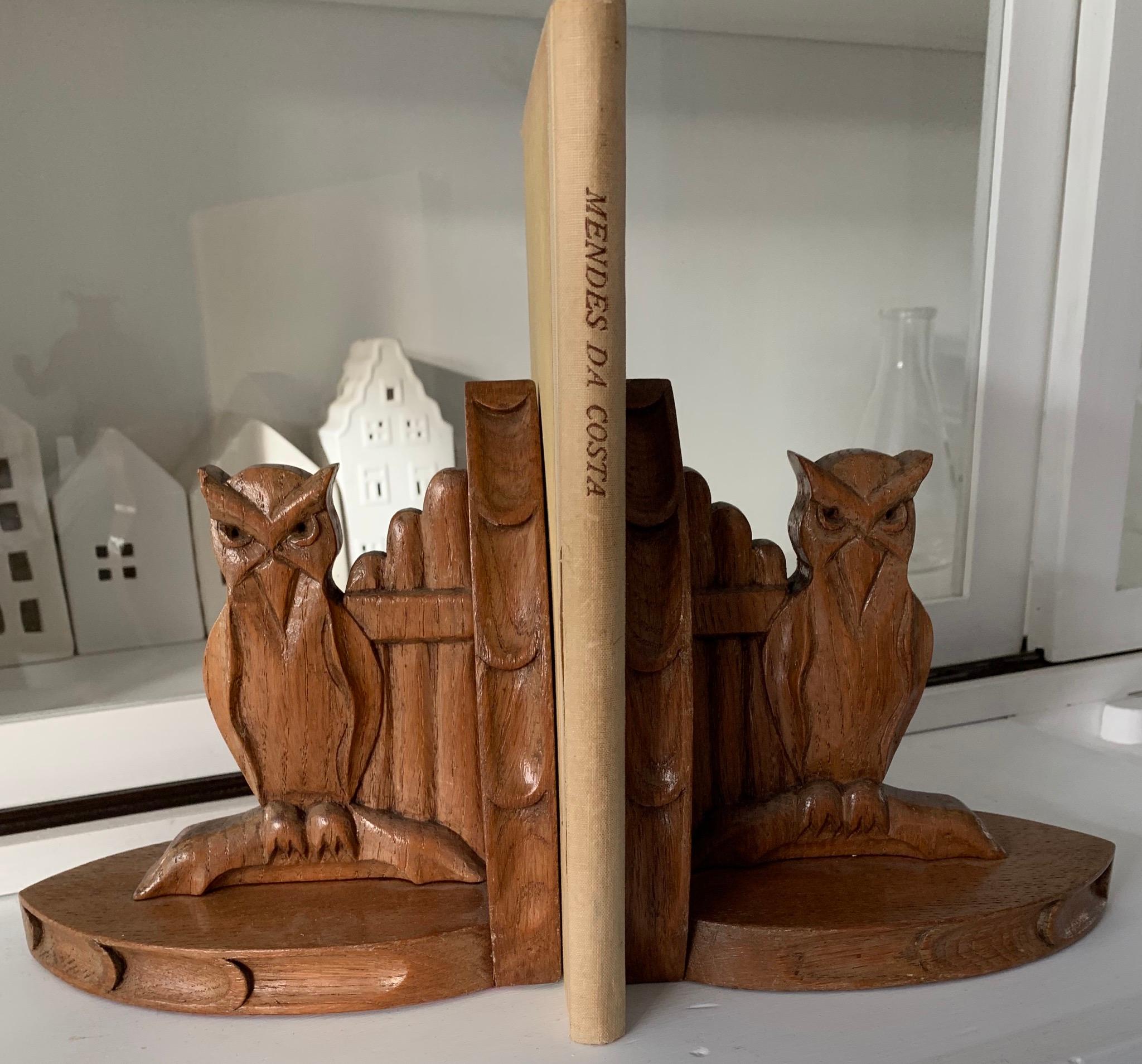 Rare and stylish standing owl sculptures book stands. 

Given the fact that owls are the international symbol for wisdom and learning, they are the perfect sculptures on a pair of bookends. These hand carved, solid oak owls are practical in size and