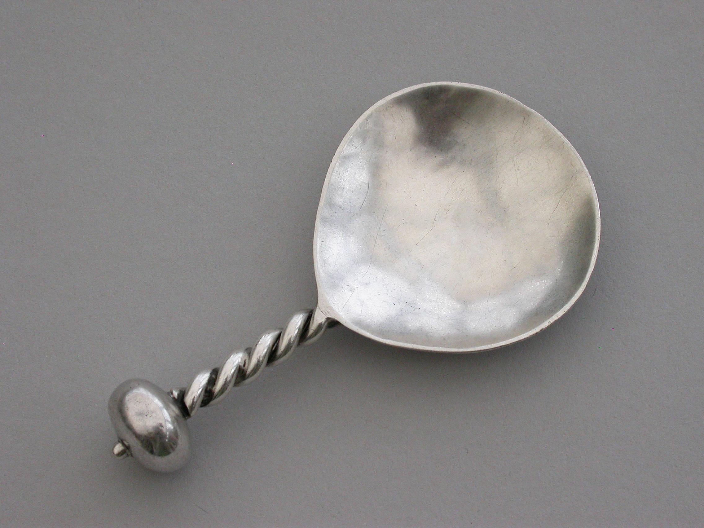 A good early 20th century Arts & Crafts silver caddy spoon with hammered bowl and twisted handle with ball finial.

By A E Jones, Birmingham, 1920

Weight 15.50 grams (0.50 troy ounces).