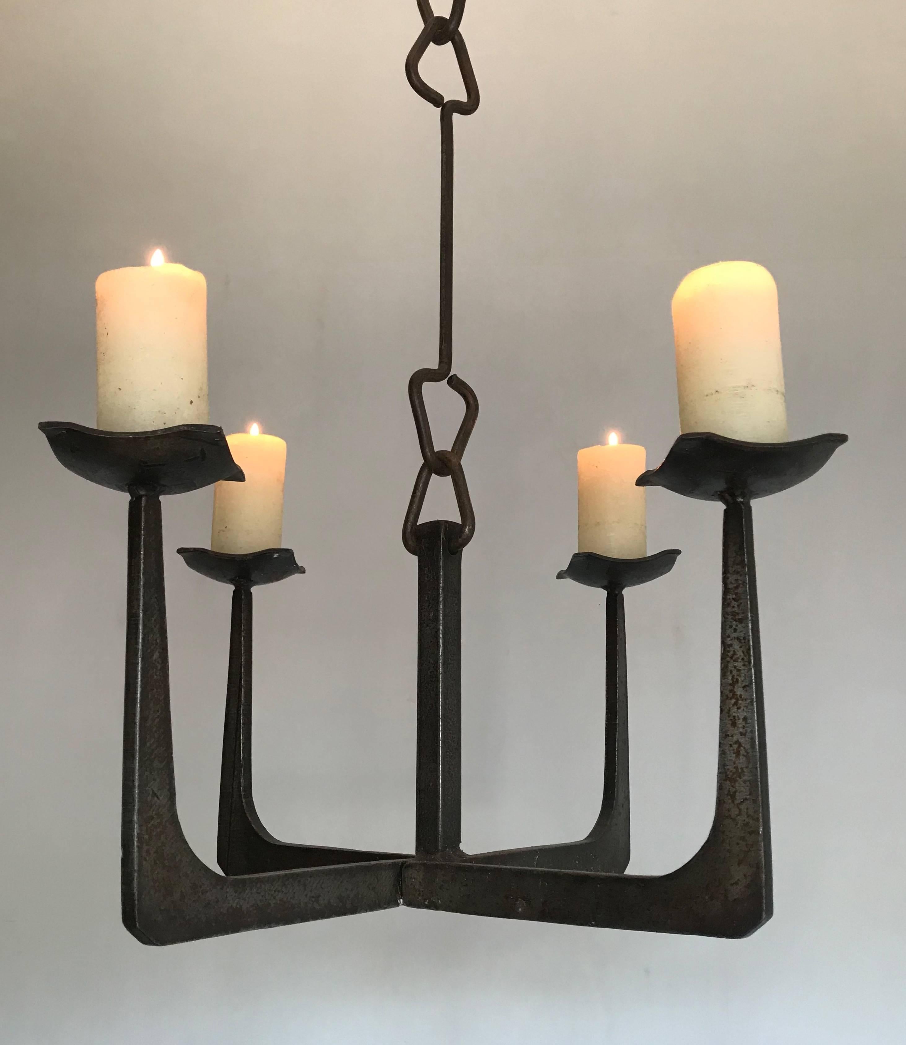 All-handcrafted, angular design candle pendant light.

This sleek & timeless candle chandelier of practical size could be the perfect lighting solution to a space that needs a special atmosphere. The angular design will make this Northern European