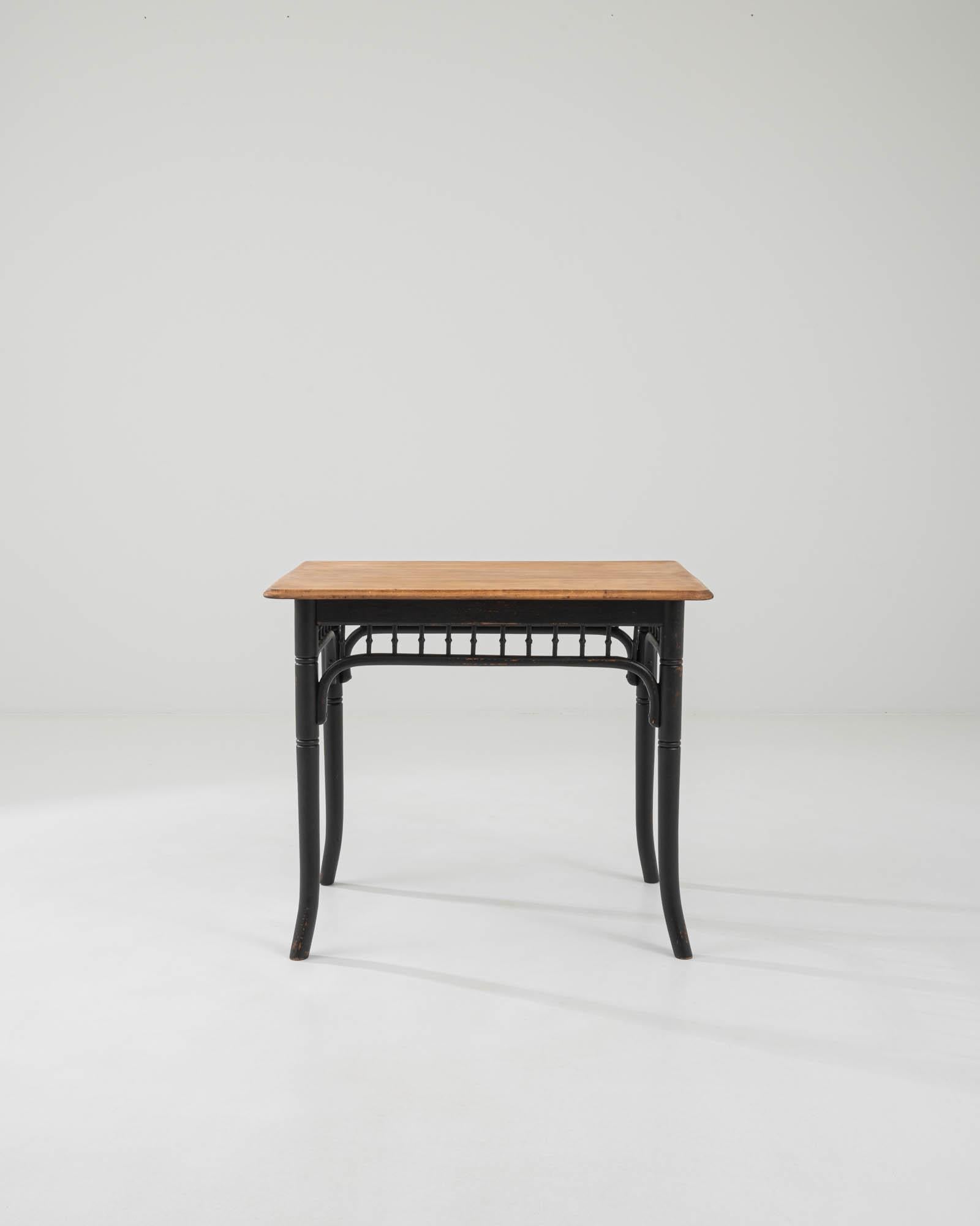 A wooden side table created in early 20th century Austria, in the style of Thonet. At first simple and unassuming, this elegantly understated side table rewards a closer inspection with lovely details and expert craftsmanship. The gently curved and