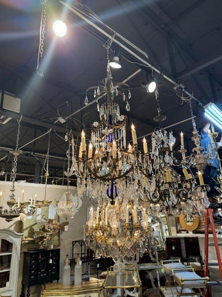 Very fine early 20th Century Baltic chandelier with crystal and bronze and featuring a piece of cobalt blue glass. Creates a beautiful traditional look! This fixture includes a chain and canopy and is wired and ready to install.