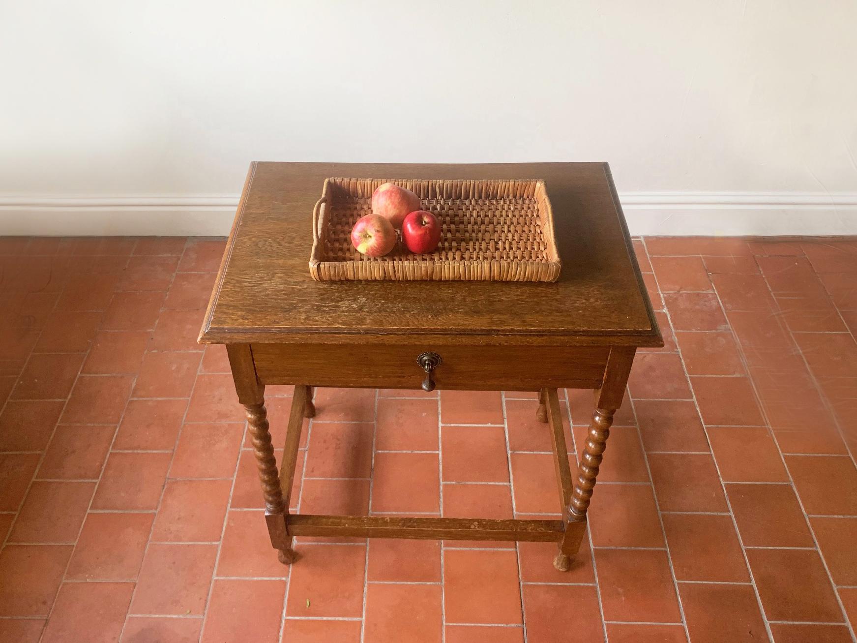 An occasional side table in solid oak with barley twist detail. Also good as a hall table or lamp table. Single drawer with brass decorative handle.

Size 
Width 67cm x depth 46cm x height 74cm

Condition:
Very good mid century condition. Minor