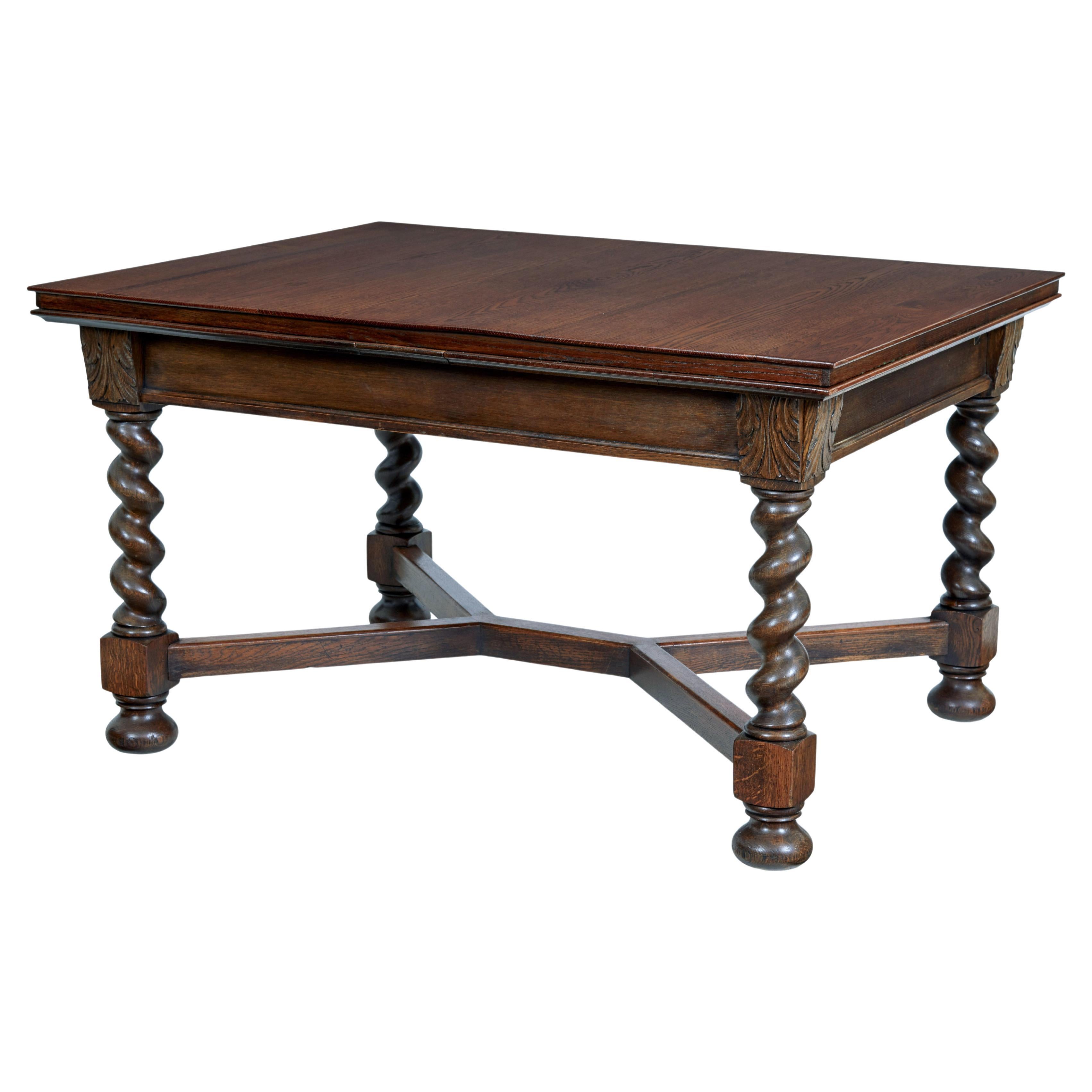 Early 20th Century baroque revival oak extending dining table For Sale