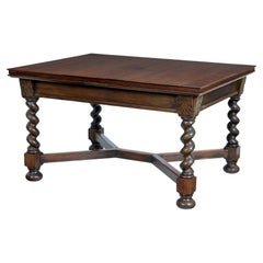 Early 20th Century baroque revival oak extending dining table