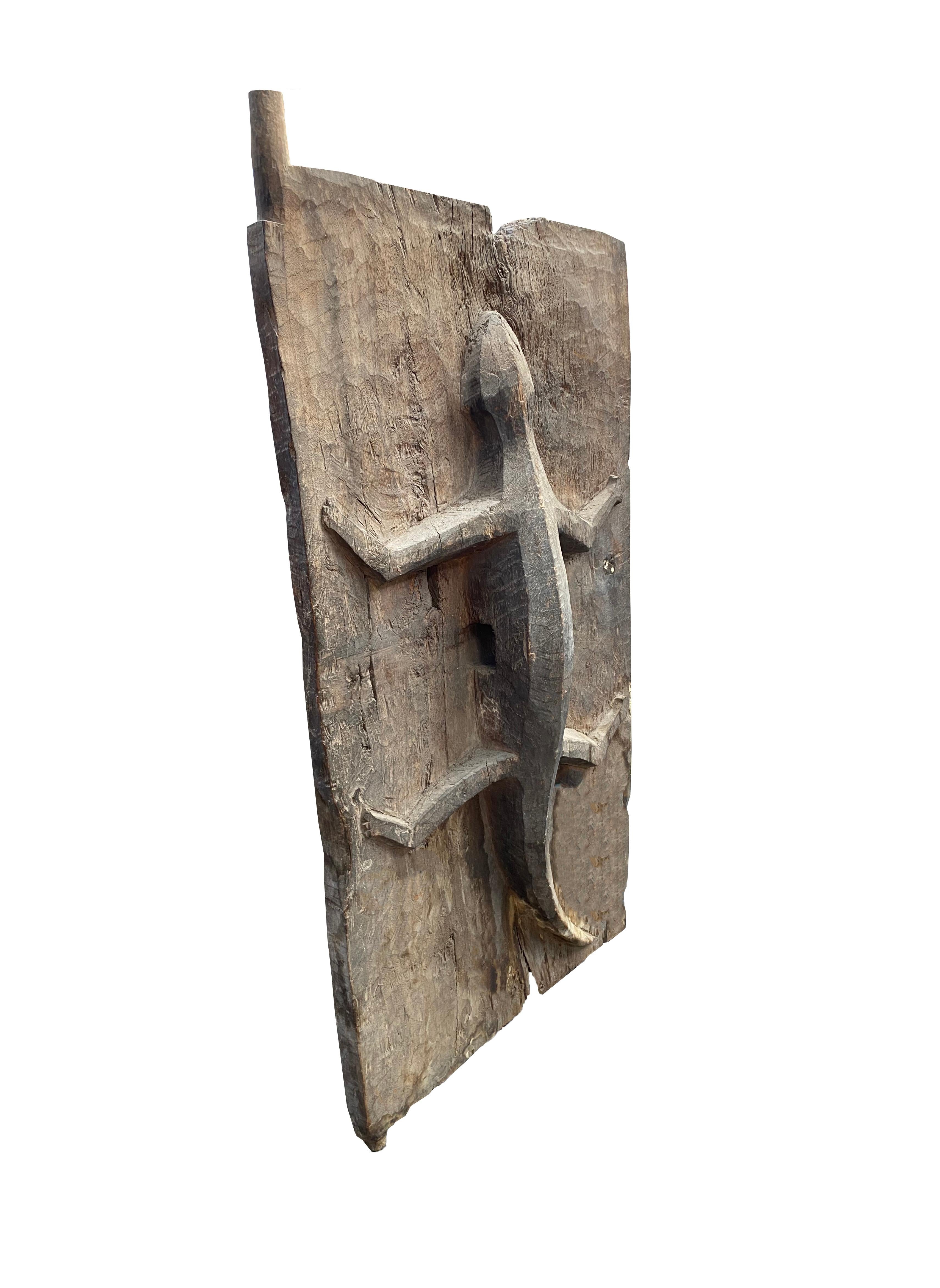 This rice granary door features a carved lizard and is from the Batak Tribe, from Lake Toba, central Sumatra. The lizard symbolises earth fertility amid Batak belief, responsible for fertility of the fields and harvesting. It thus makes sense to