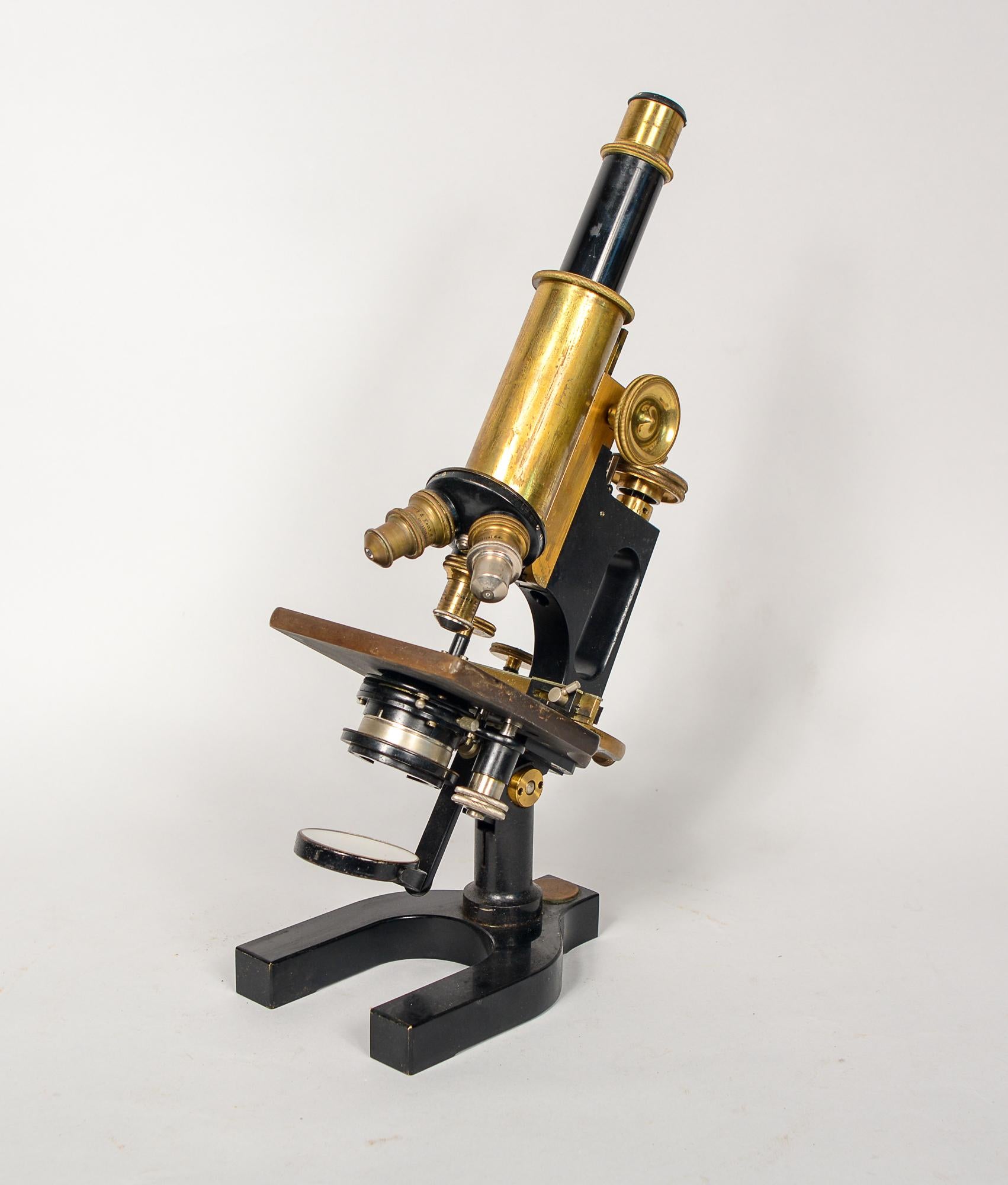 Bausch and Lomb jug handle microscope. This microscope has three objectives. The microscope is 4.25 inches deep, 7 inches wide and 13 inches tall. This is from an older collection belonging to a doctor. We do not know the functionality of this.