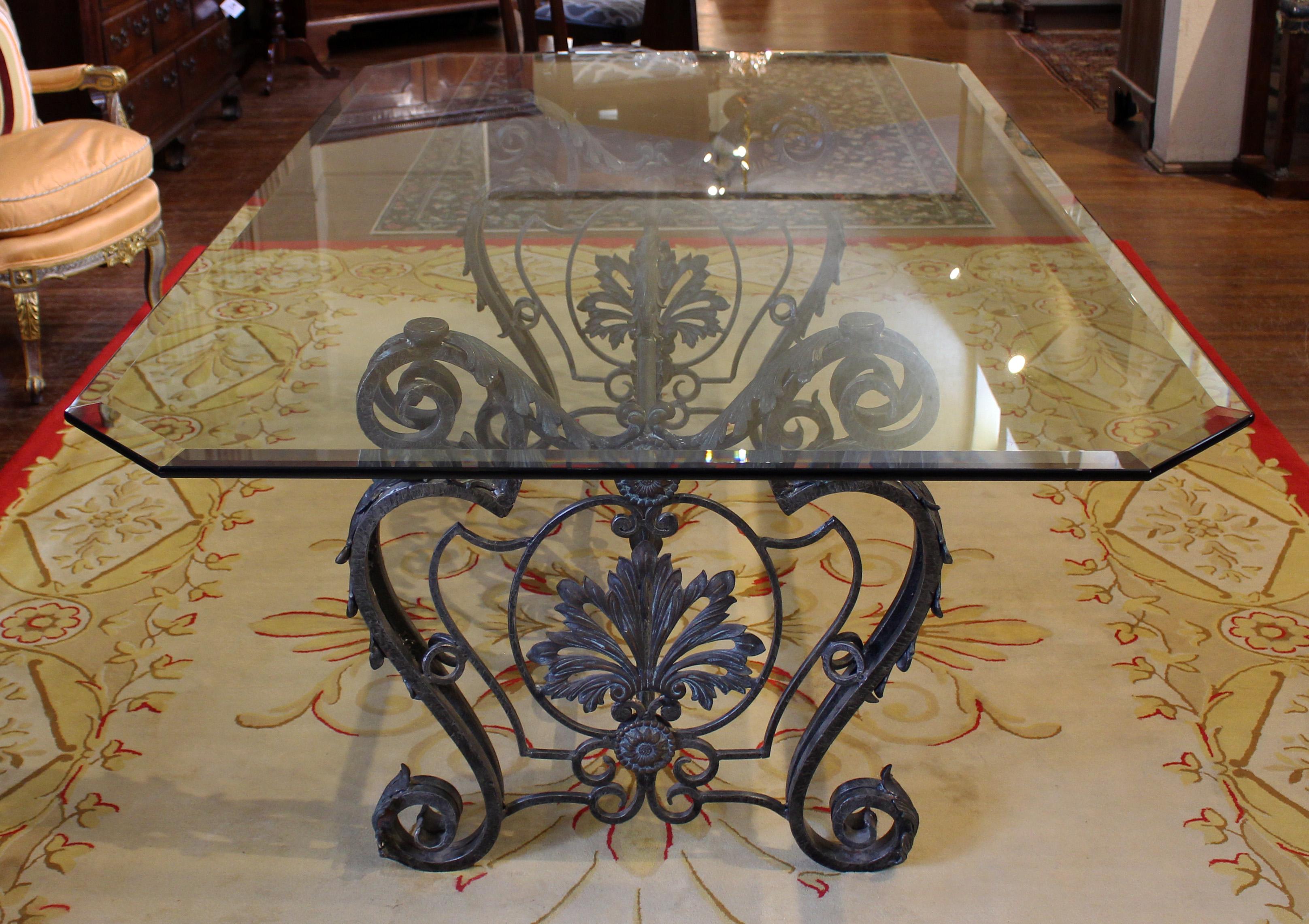 Beaux-Arts cast bronze & wrought iron glass top dining table, French, early 20th century. Undoubtedly this was once a baker's table with a smaller marble top, now with custom thick glass top allowing the full beauty of the base to come through. Each