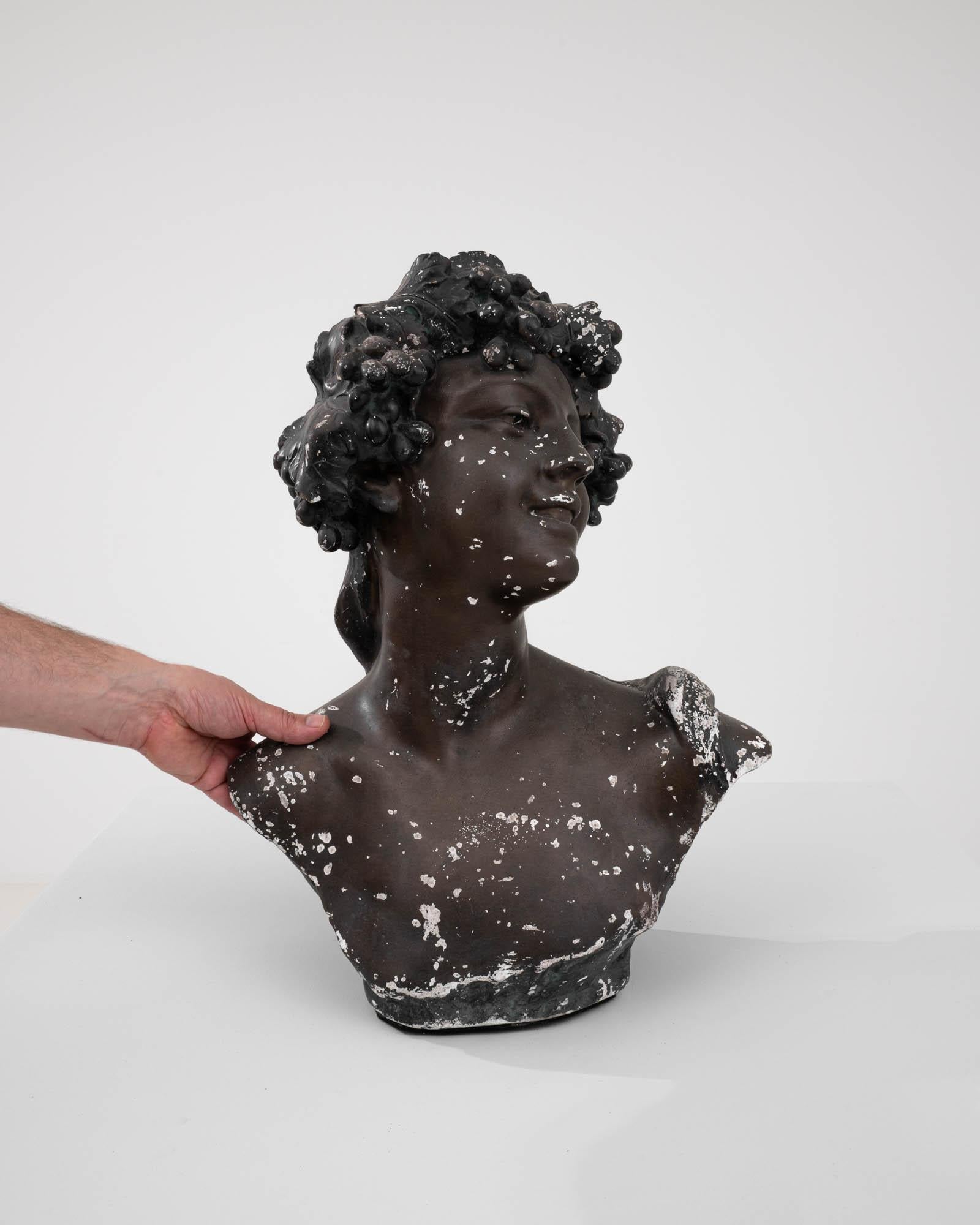 Discover the enchanting beauty of our Early 20th Century Belgian Plaster Sculpture by renowned artist Jef Lambeaux. This captivating masterpiece portrays a young woman with flowing locks, exuding timeless elegance and grace. Crafted with exquisite