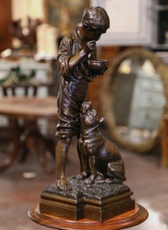 Sculpture belge du début du 20e siècle en Spelter Boy and Dog signée V. Rousseau
