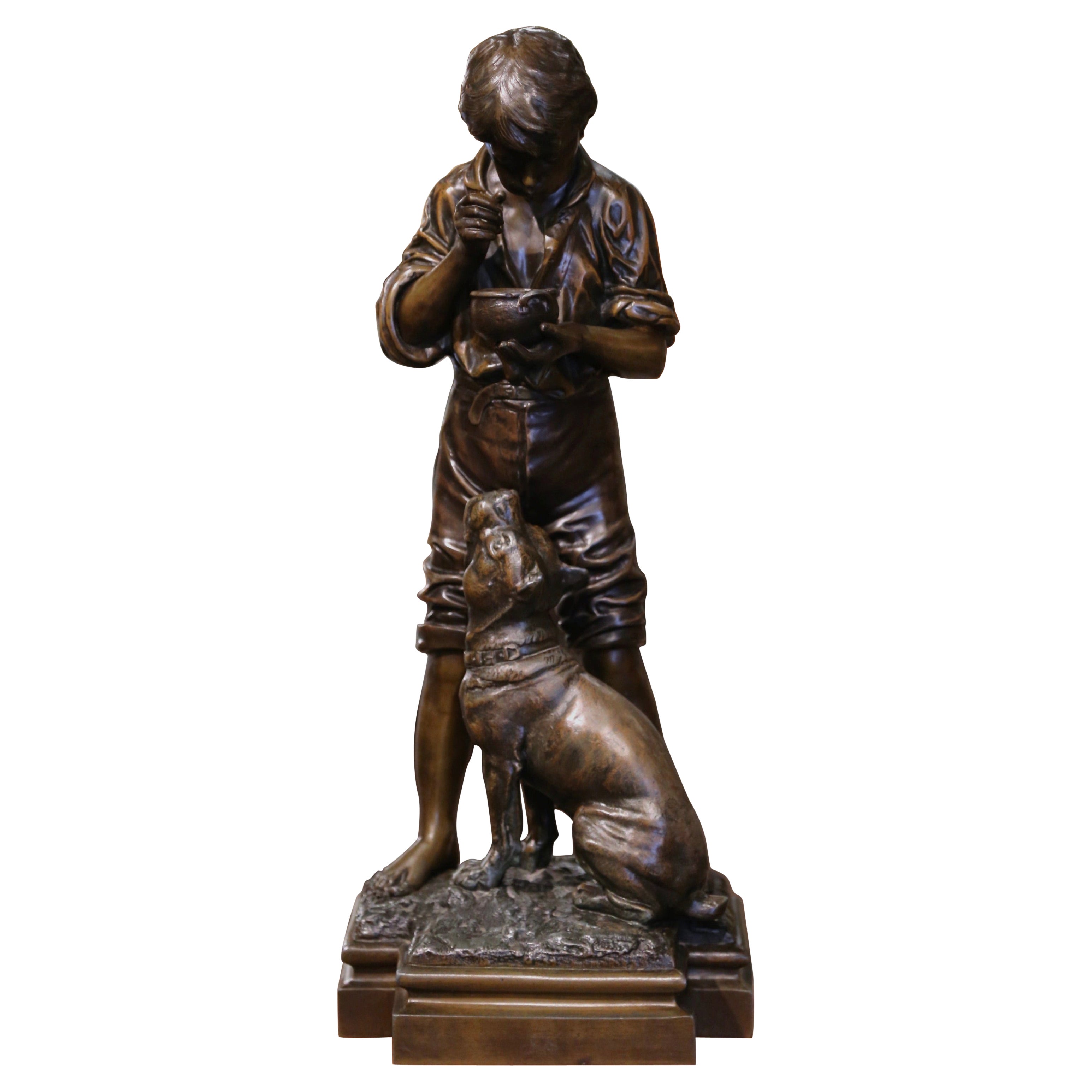 Scultura di ragazzo e cane in spelta belga dei primi del Novecento firmata V.I.I. Rousseau
