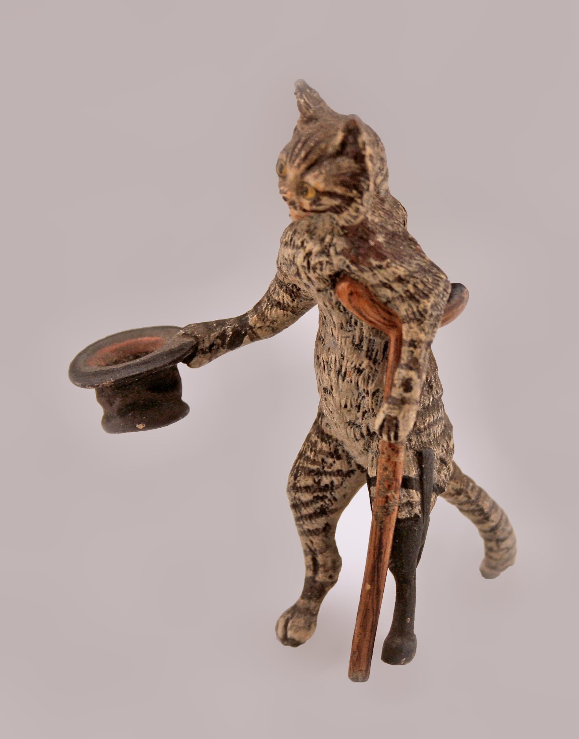 Early 20th century Belle Époque bronze beggar cat by austrian maker Franz Bergmann

By: Franz Bergmann
Material: bronze, paint, copper, metal
Technique: cast, cold-painted, painted, patinated, metalwork, molded
Dimensions: 2.5 in x 2 in x 3 in
Date:
