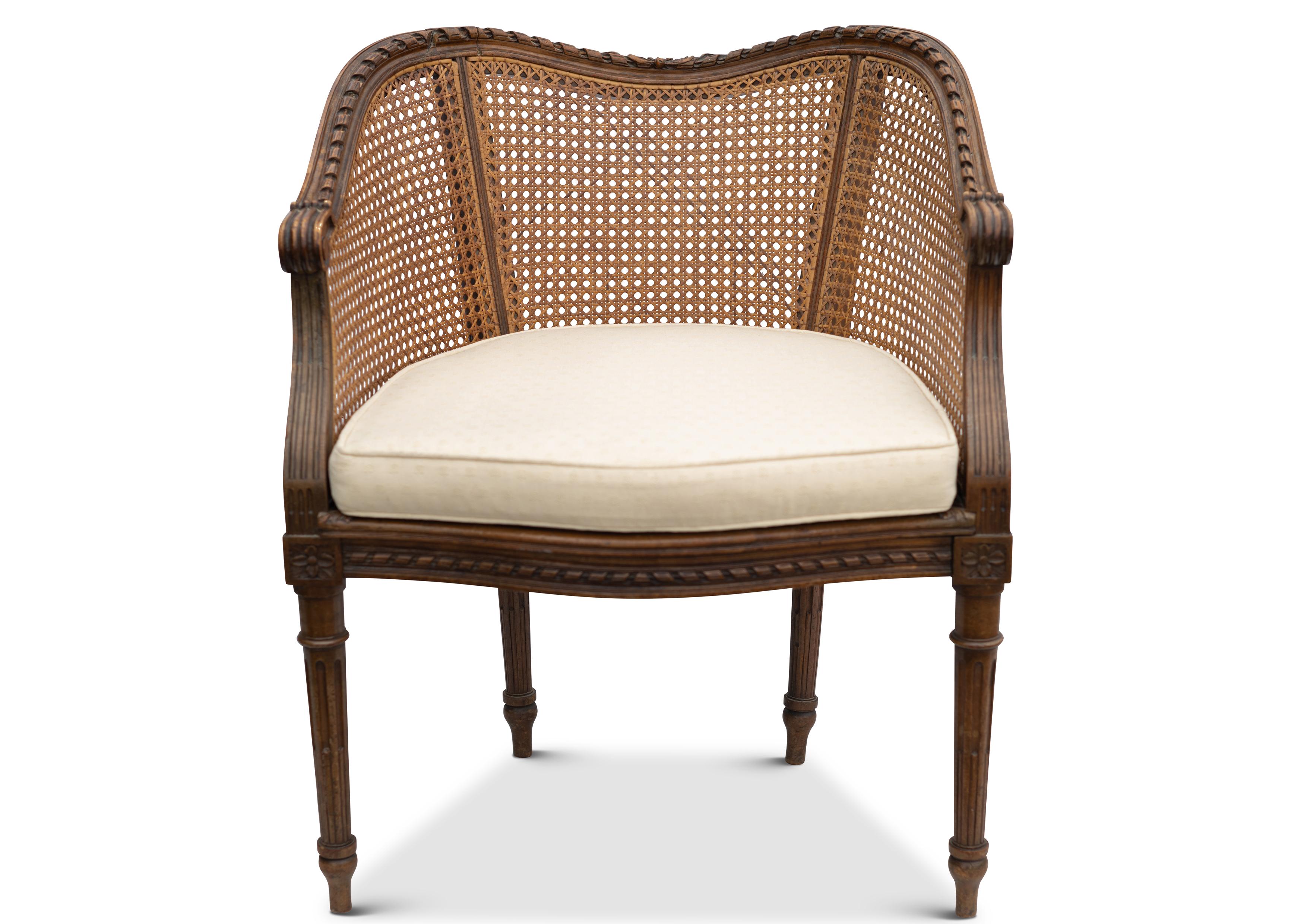 Early 20th century Bergère Beech Decorative Carved Armchair With Cream Upholstered Seat Upon Empire Legs circa 1900s 

Height to arms 60cm.