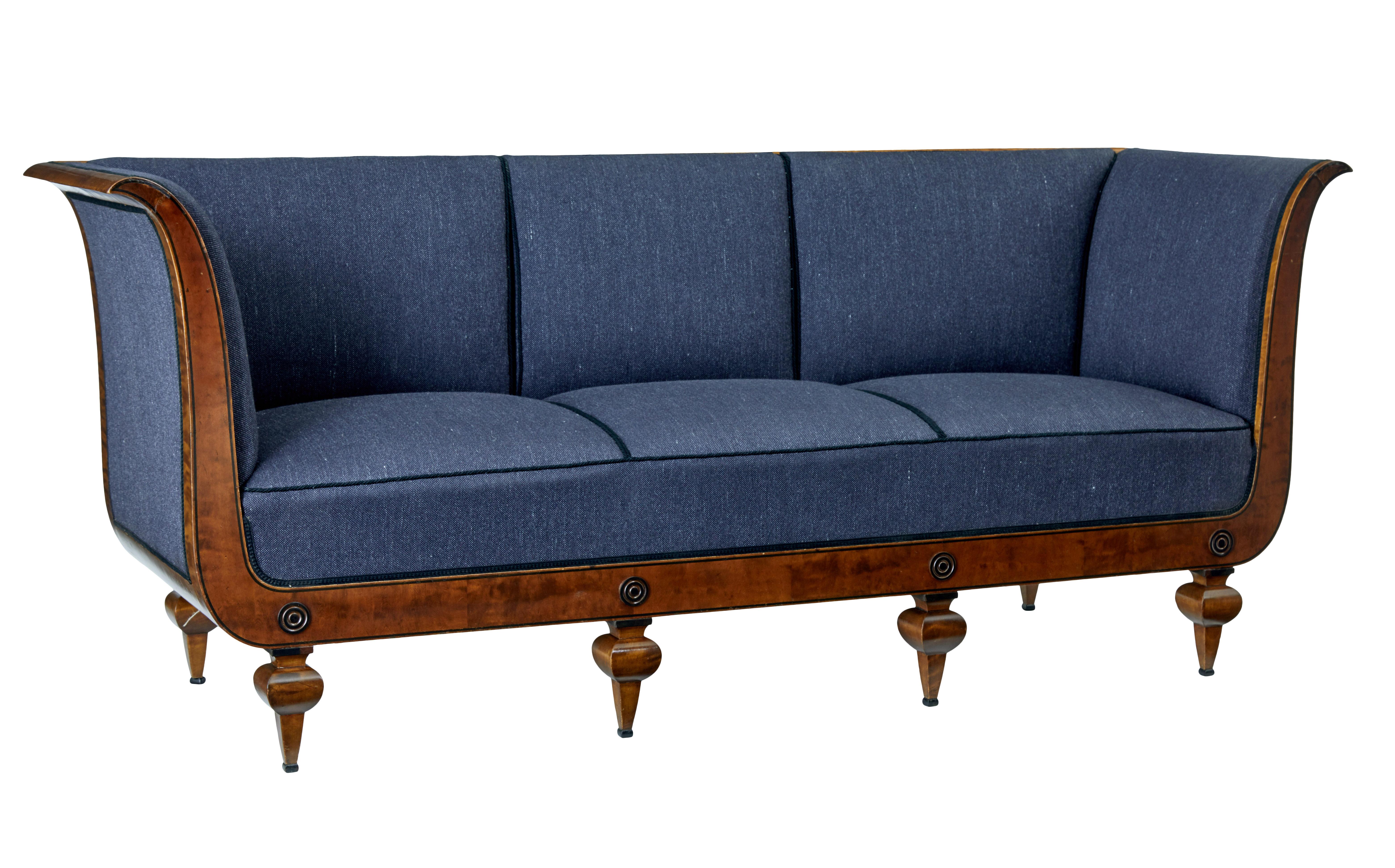 Superb quality Art Deco period sofa attributed to David Blomberg.

3-seat sofa, scrolling arms with ebony inlay down the arms and along the front frieze. Decorated with applied roundels and standing on 6 shaped legs.

Upholstery in good