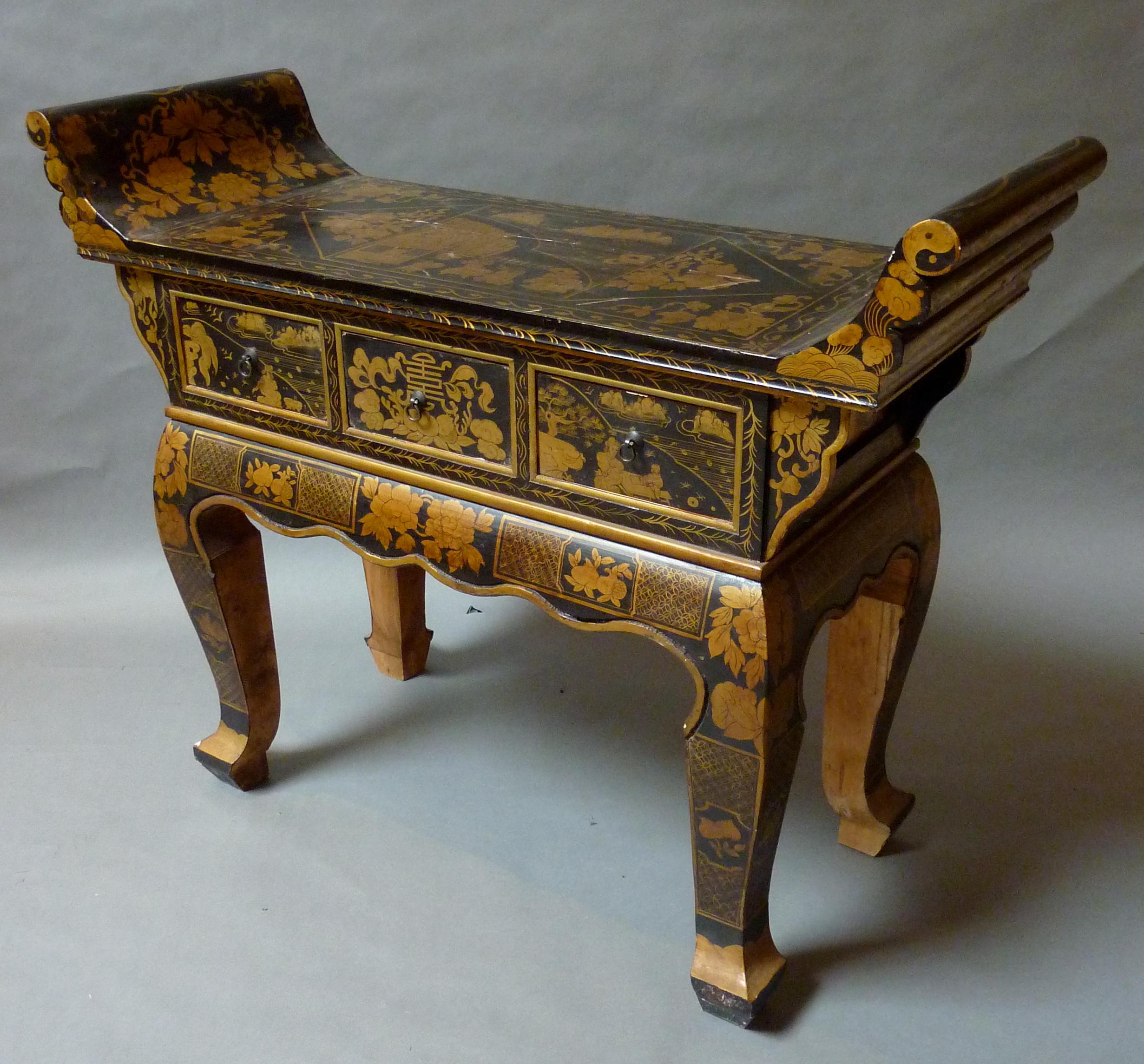 Early 20th century Tibetan altar table. Made in the antique style with black lacquer and intricate gilt floral decoration, shaped top above three drawers over scalloped apron and boldly shaped cabriole legs. 
Tibet, circa 1900.
Measures: 38” H 49” W