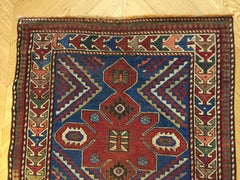 Early 20th Century Blu and Red Natural Wool Caucasian Medallion Kazak Rug