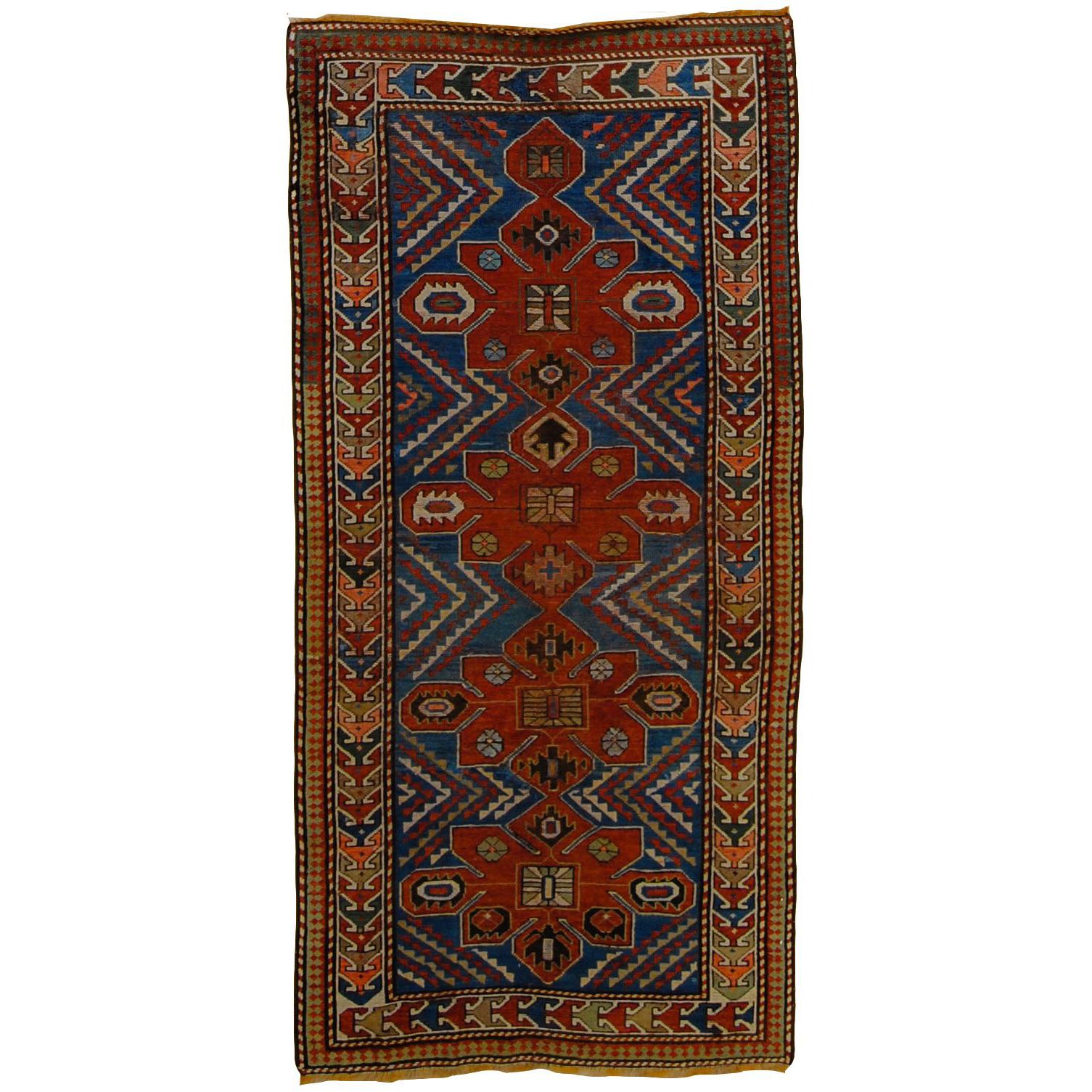 Early 20th Century Blu and Red Natural Wool Caucasian Medallion Kazak Rug
