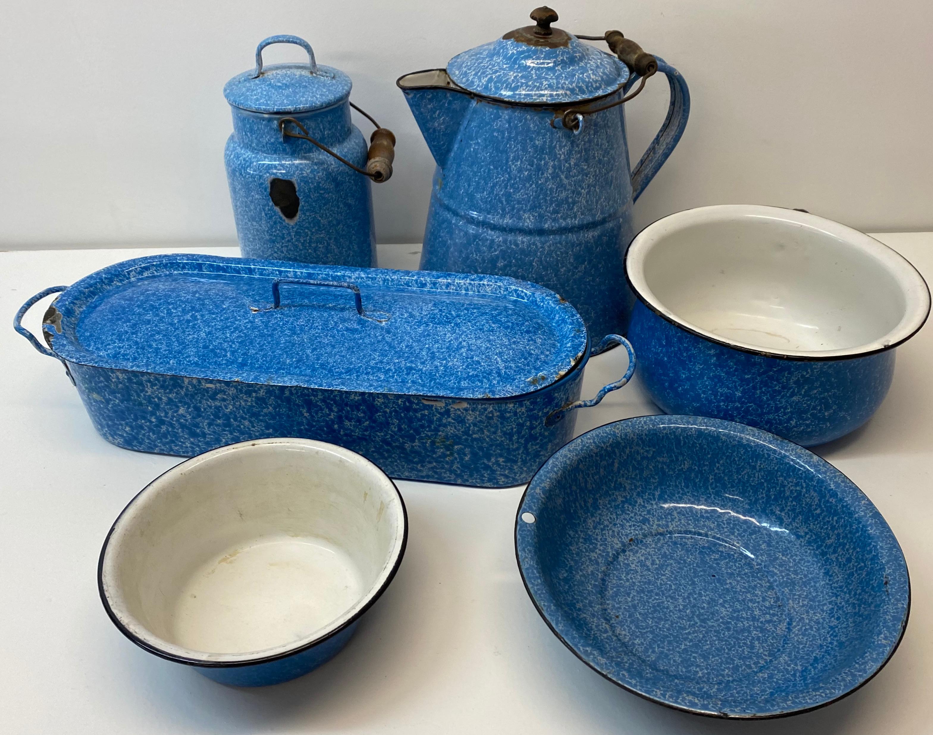 Early 20th century blue and white graniteware six pieces

A fine old collection of antique American metal and enamel graniteware

A coffee pot, coffee can with lid, a long narrow steamer dish with insert two bowls and a basin

Various