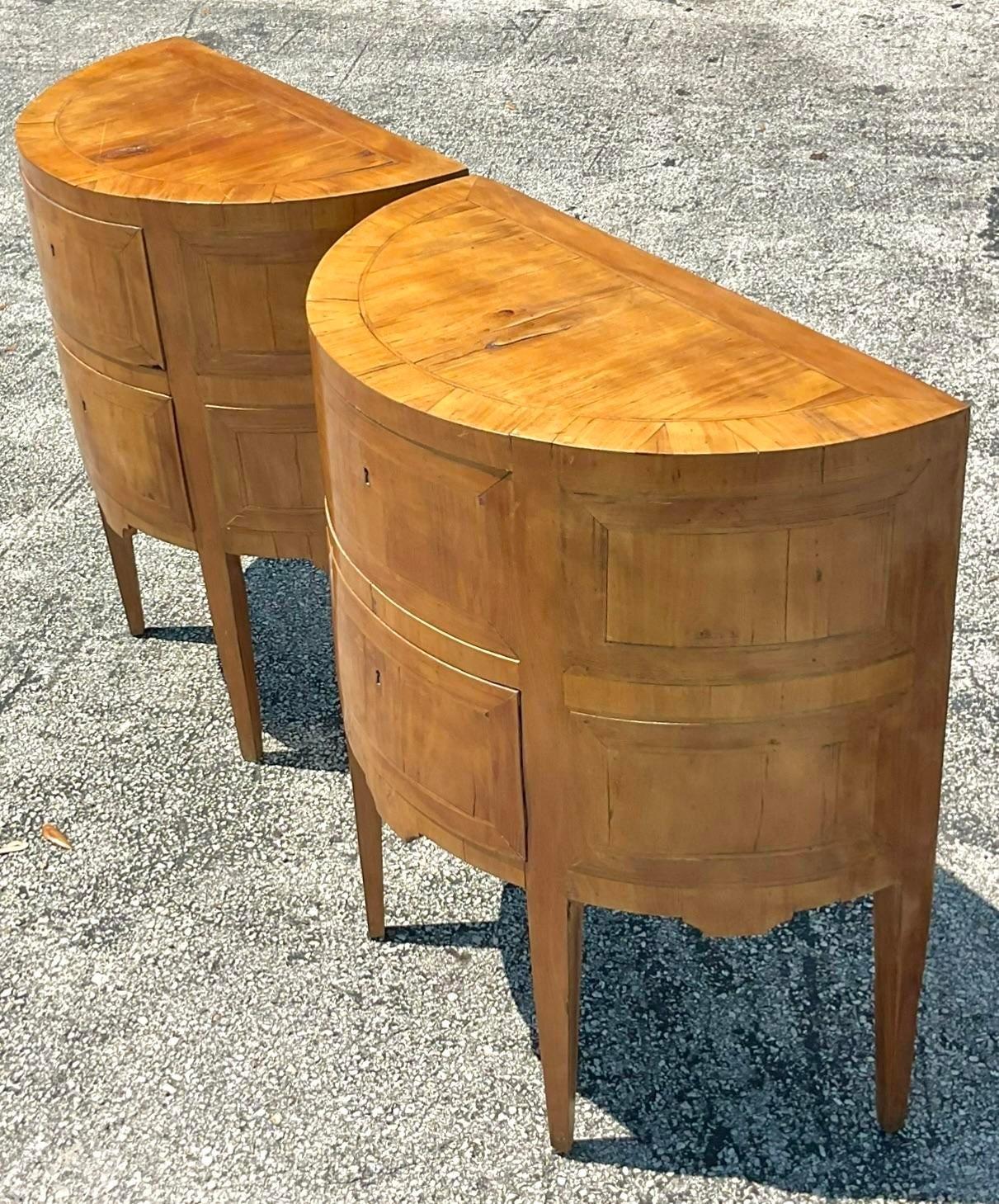 A spectacular pair of vintage Boho chest of drawers. A chic Demilune shape in a pale Burl wood frame. Incredible wood grain detail. Open with a key. Acquired from a Palm Beach estate.