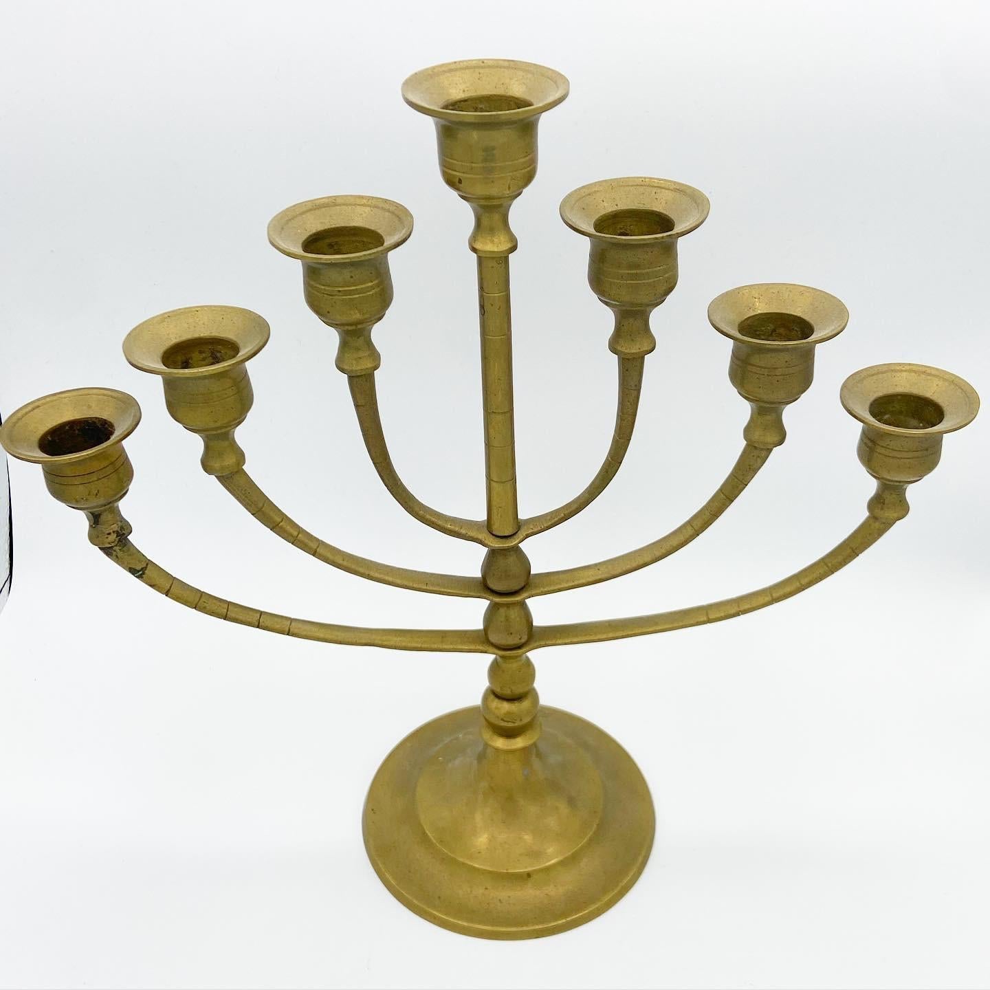 Beautiful brass candelabra with 7 candlestick holders.

Additional information: 
Material: Brass
Color: Brass
Style: Boho Chic
Time period: early 20th century
Dimension: 11.75