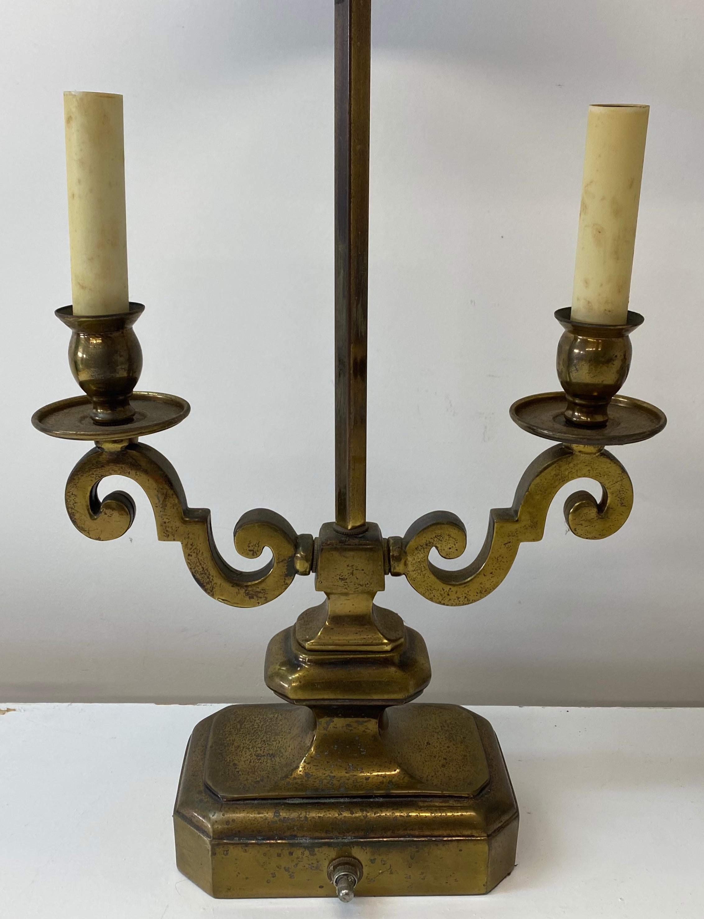 Early 20th century Bouillotte style brass & metal table lamps, C.1930

Hand painted shades over cast brass double arm bases

8