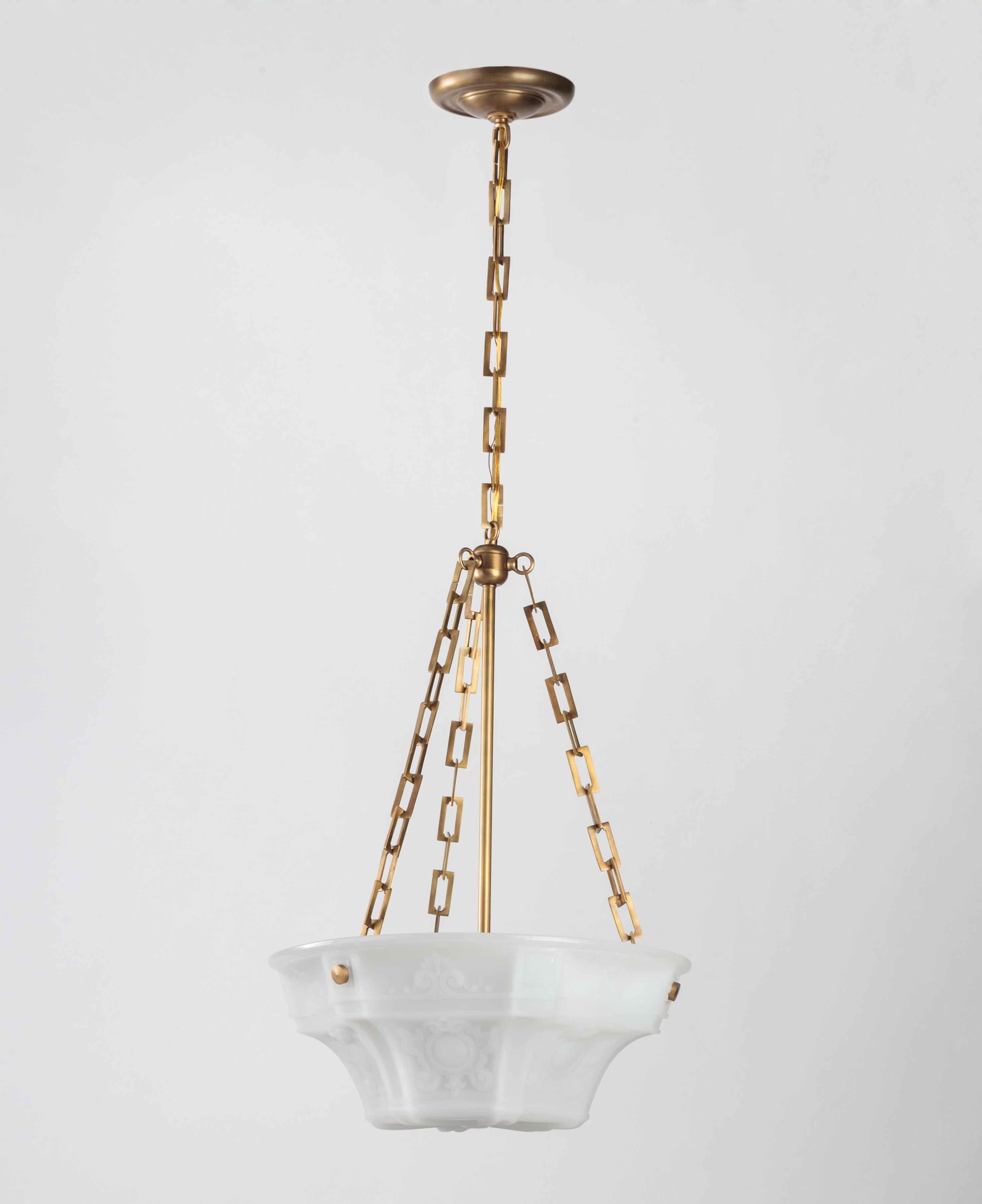 AHL3778

An antique cast opaline inverted dome chandelier suspended on brass fittings. Due to the antique nature of this fixture, there may be some nicks or imperfections in the glass, circa 1910

Dimensions:
Current height 42-1/2