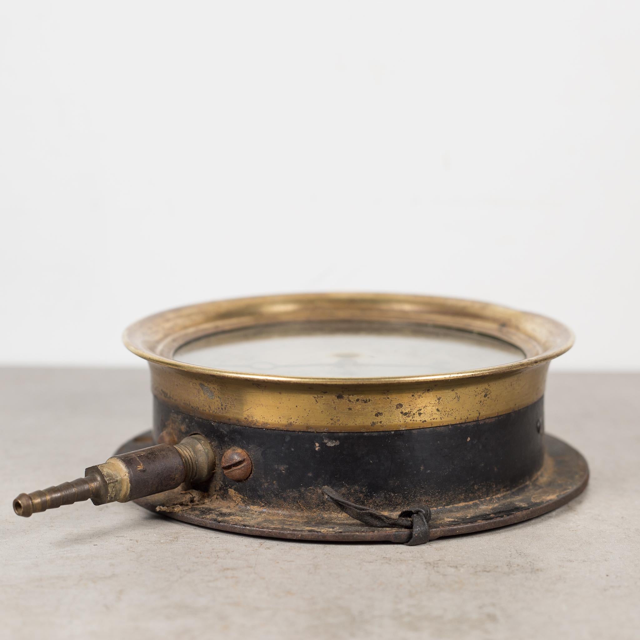About

An antique brass ship or locomotive pressure gauge with glass front and steel base. This piece has retained its original finish with minor blemishes on the glass. The glass is not cracked or chipped.

 Creator: Ashcroft, New York.
 Date