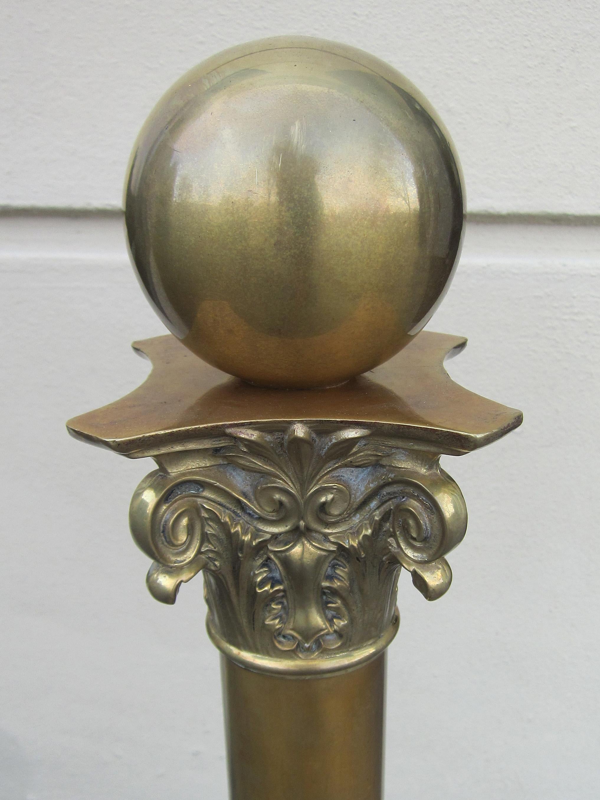 Early 20th century brass andirons with ball finials.