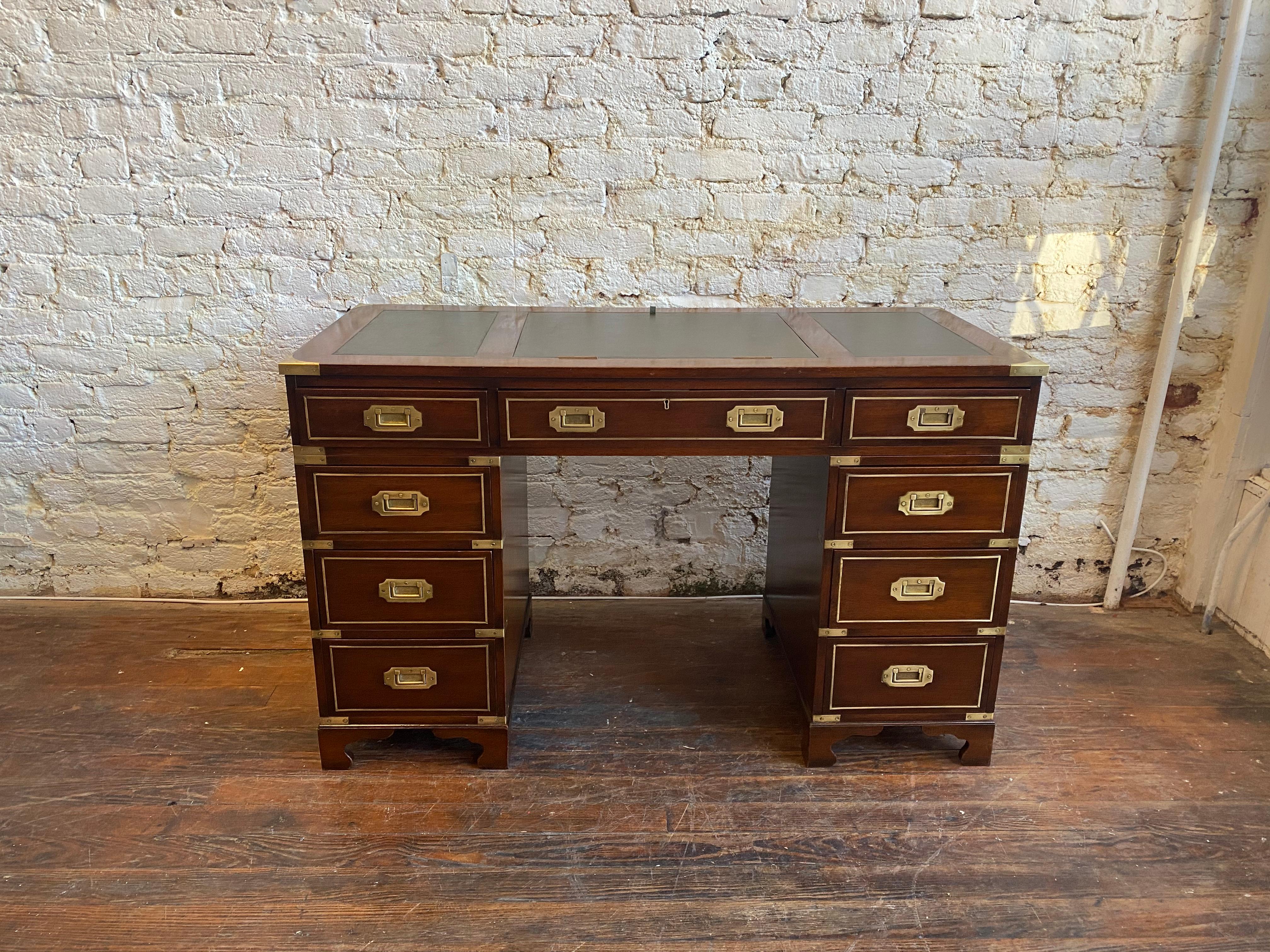 Early 20th century brass bound leather and mahogany three-part Campaign desk. Great height, color, and form. Adjustable writing slope.