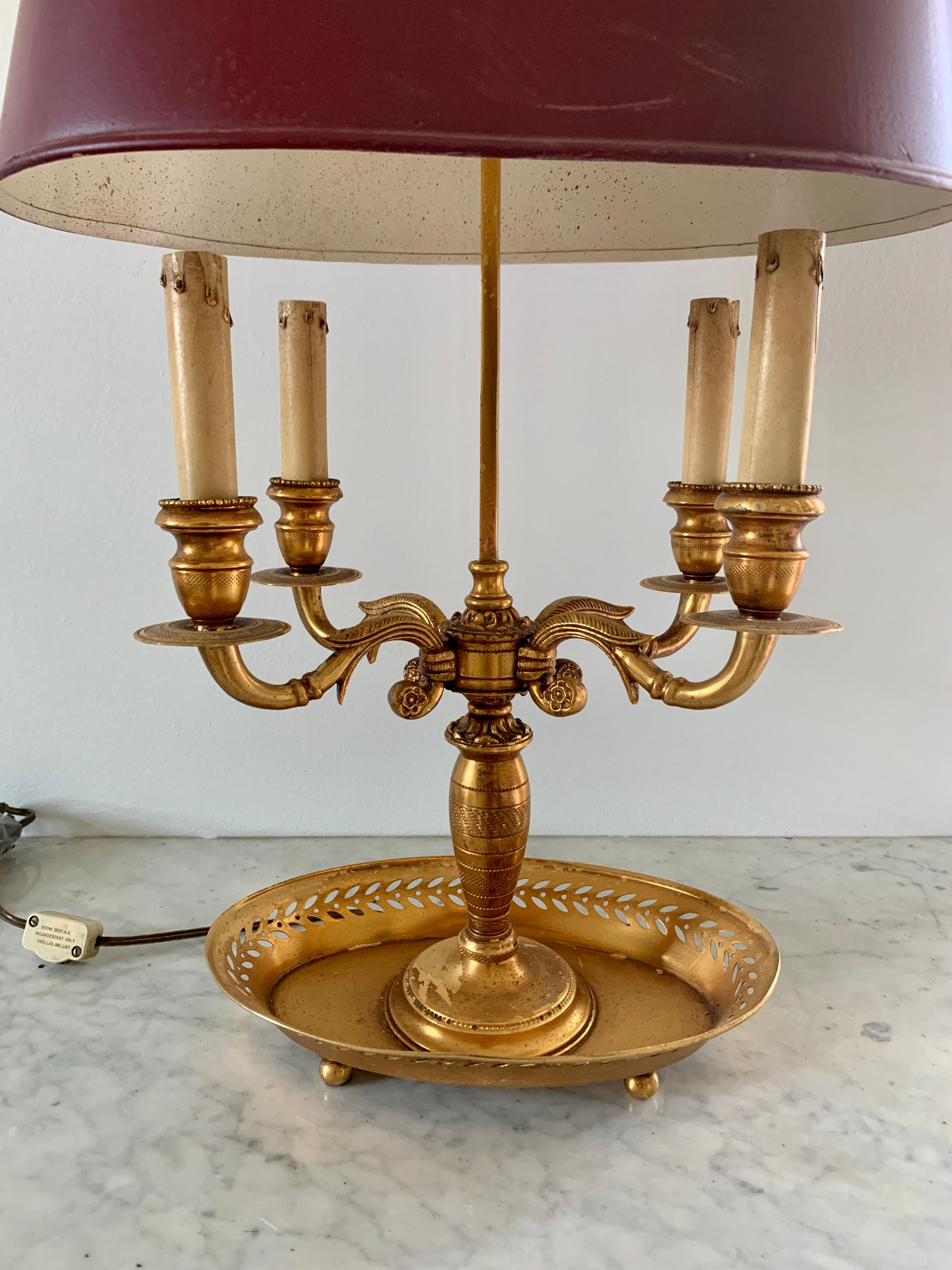 American Early 20th Century Brass Four Arm Bouillotte Lamp with Burgundy Tole Shade For Sale