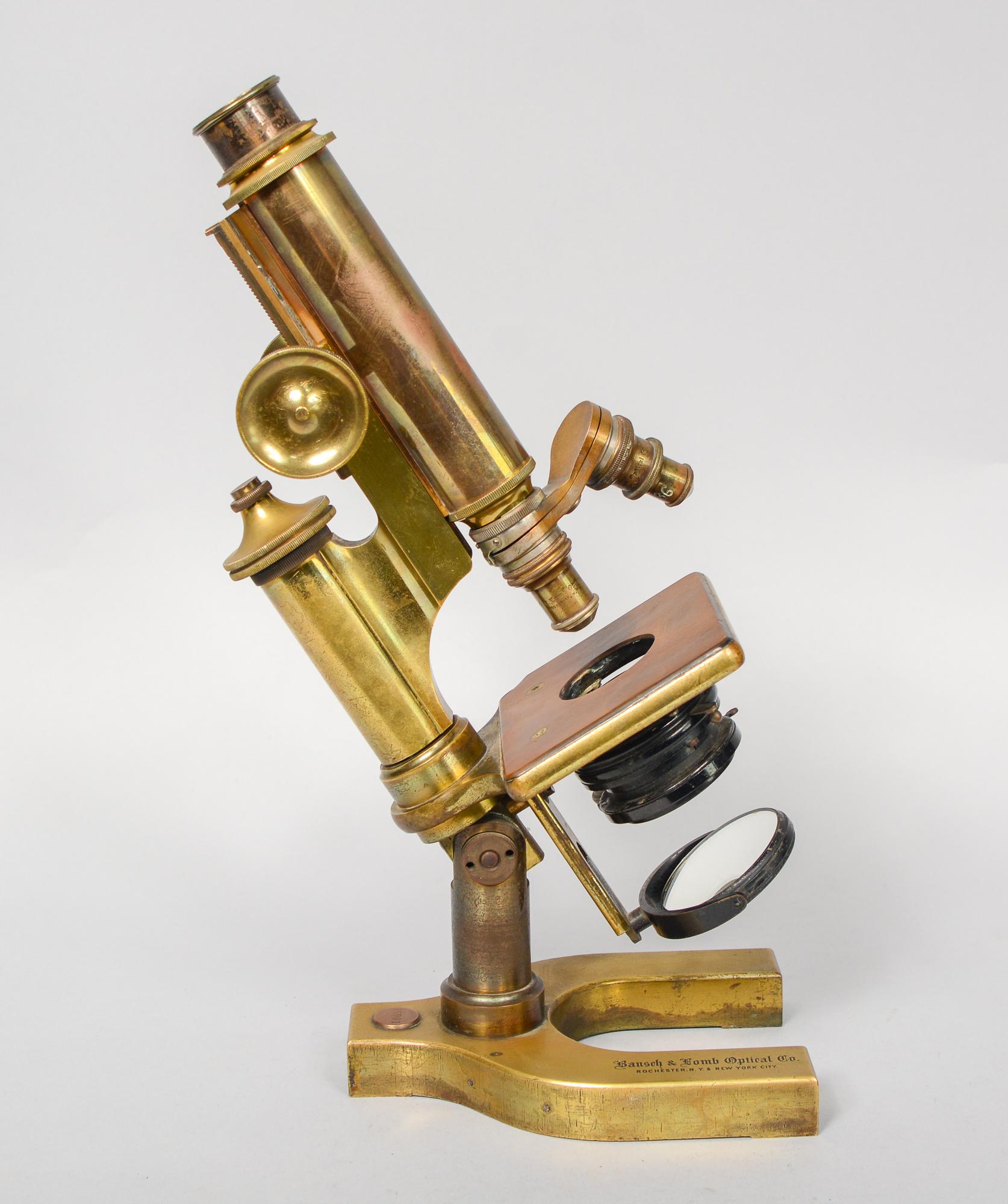 Brass and iron Bausch and Lomb microscope. This microscope has two objectives. Dimensions listed are for the box. The microscope is 4.25 inches deep, 5.75 inches wide and 13 inches tall. This is from an older collection belonging to a doctor. We do