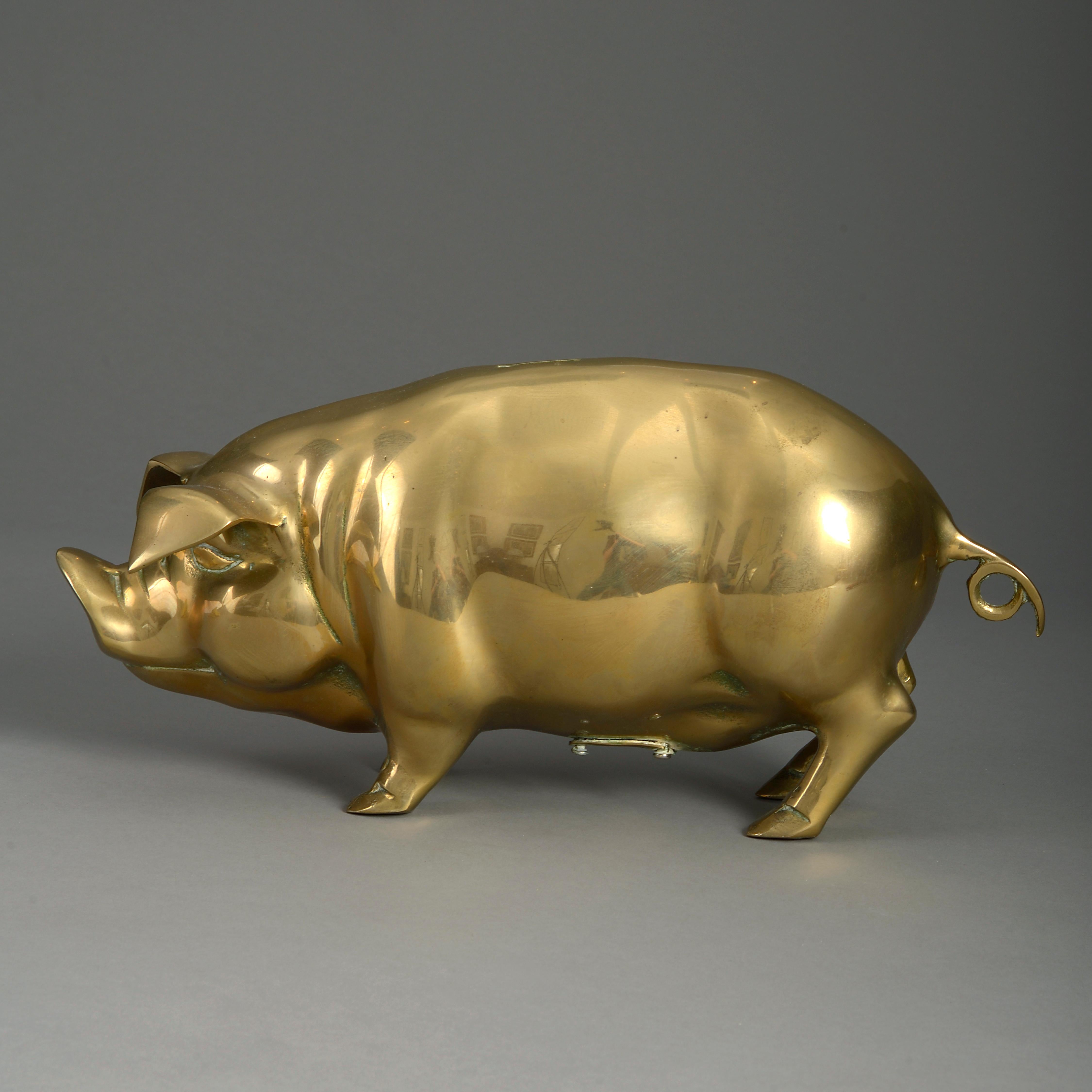 An early 20th century brass piggy bank.