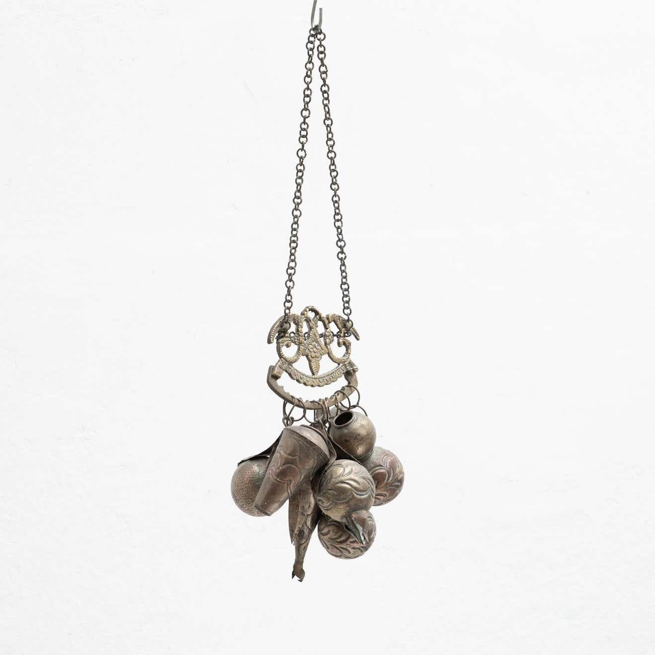 Early 20th century metal hanging amulet from native culture in Brazil. Known as 'Penca de Balangadas' was used in the ancient times as an amulet by the scale population in Brazil.

Made in Brazil by unknown artist, circa 1890.

In original