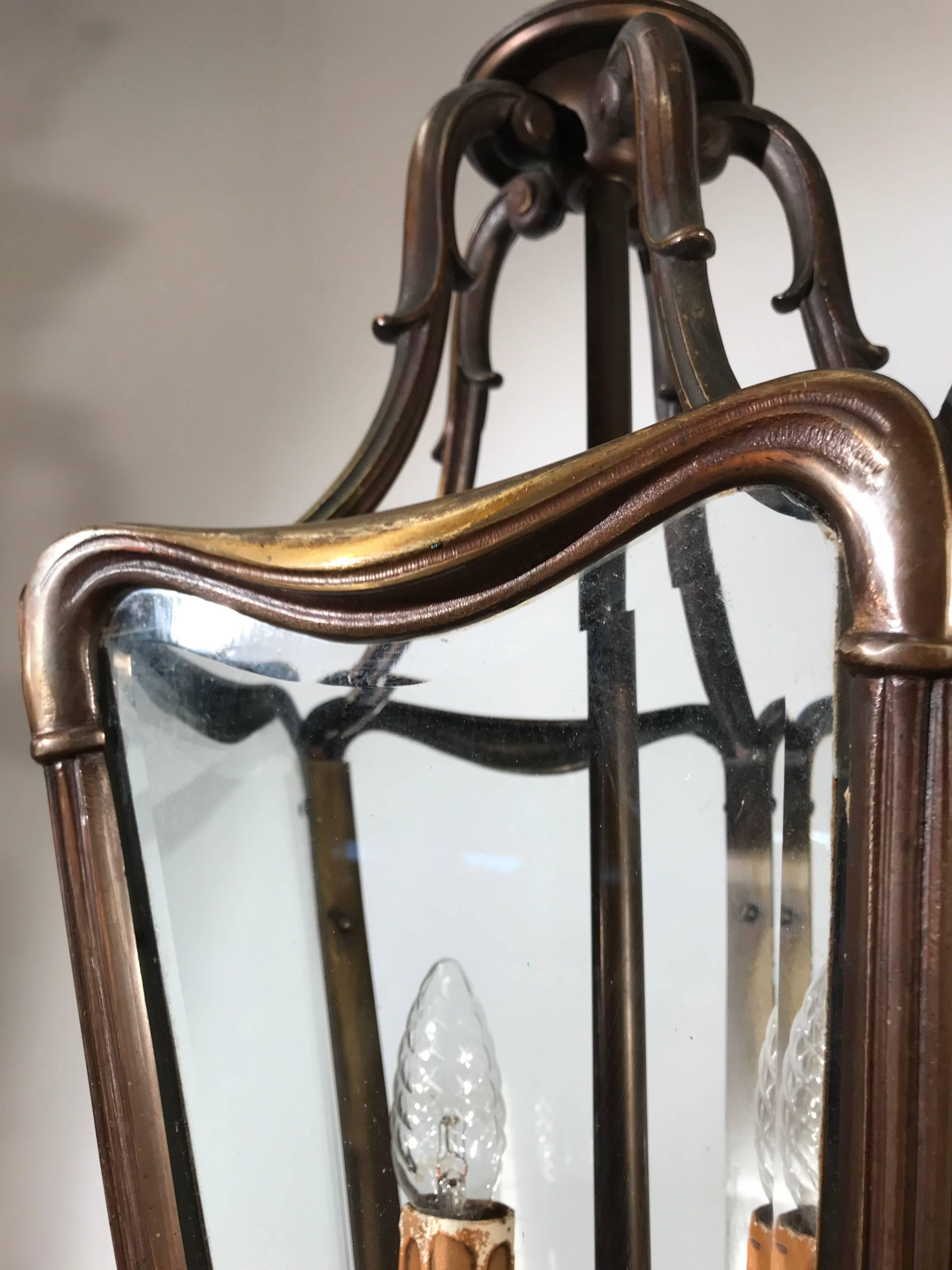 Highly stylish and classy lantern with solid bronze frame.

If you are looking for a quality made, sizable, durable, stylish and excellent condition pendant then this wonderful specimen could be perfect for you. This highly stylish pendant comes