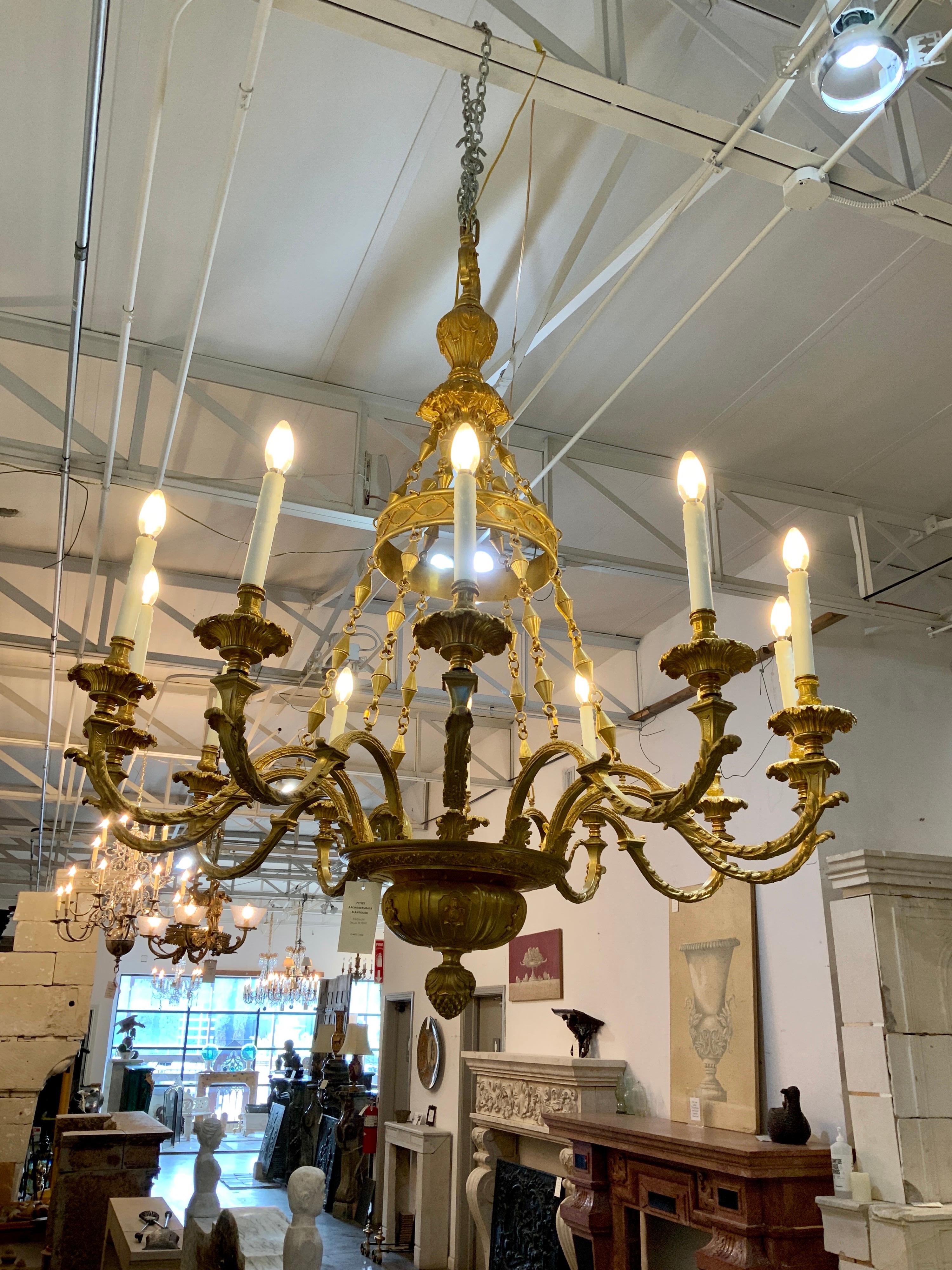 This bronze chandelier origins from France, circa 1920.