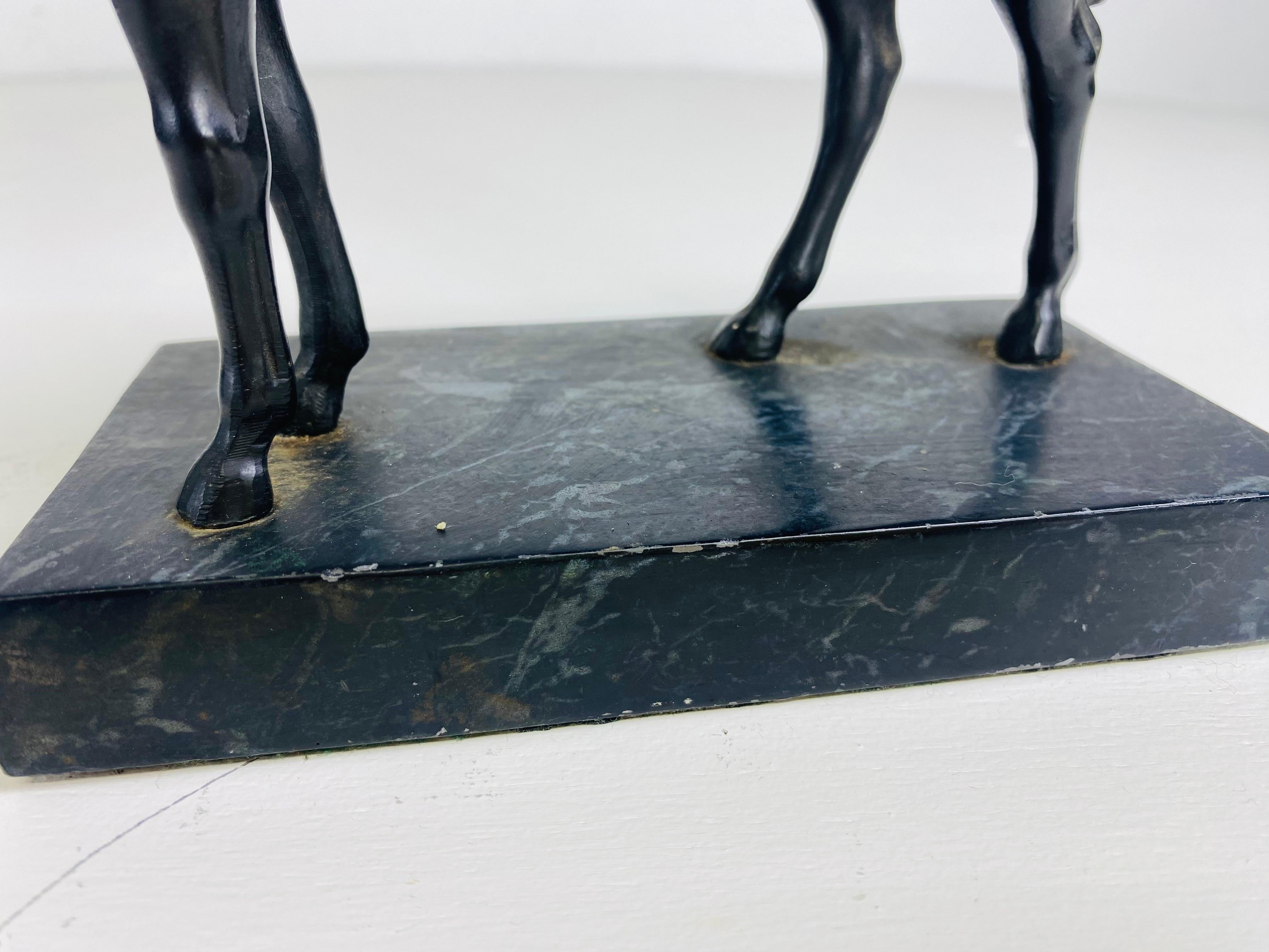 This is an early 20th century equestrian horse sculpture in bronze. This horse sculpture has a dark ebony bronze finish to the surface and stands on a bronze weighted base. The bronze is from American art deco period circa 1920.