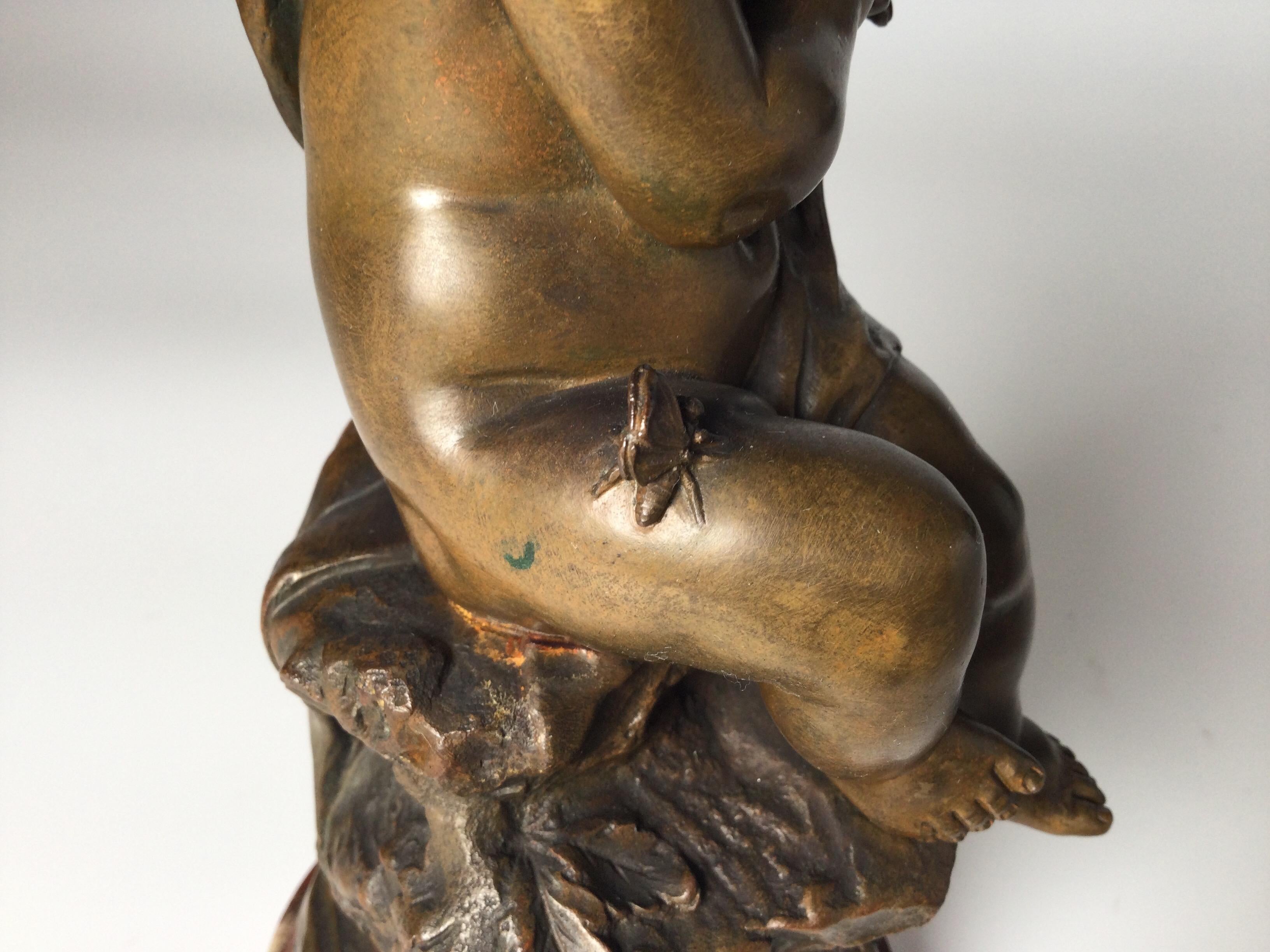 Bronzo Figura di cherubino in bronzo dei primi del Novecento su base di marmo in vendita