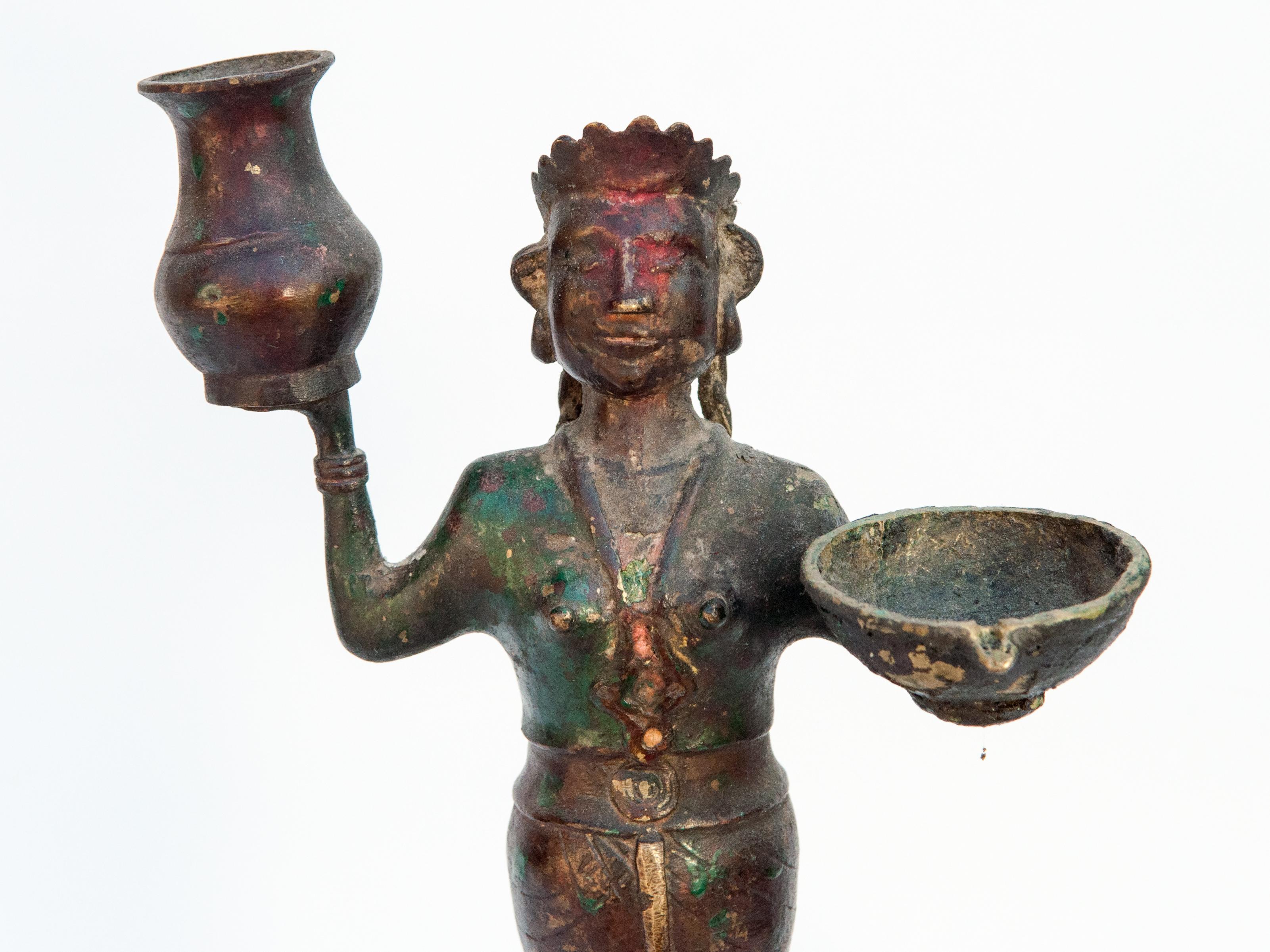 Early 20th century bronze oil lamp from South Nepal. 18