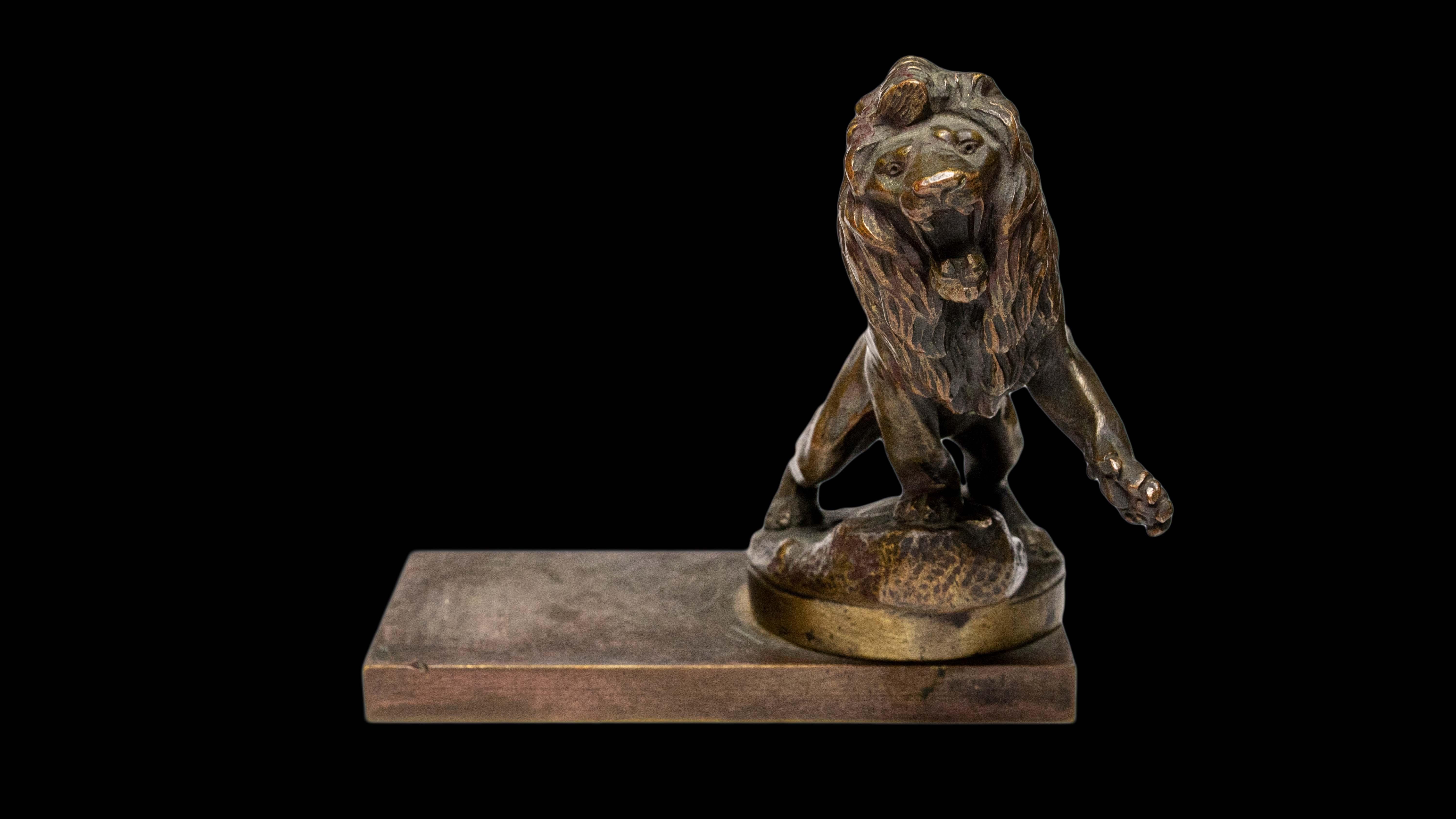 Early 20th century bronze Peugeot Lion radiator ornament by Maurice Roger Marx (1872-1956) mounted on antique die stamp:

Measures: 5.5