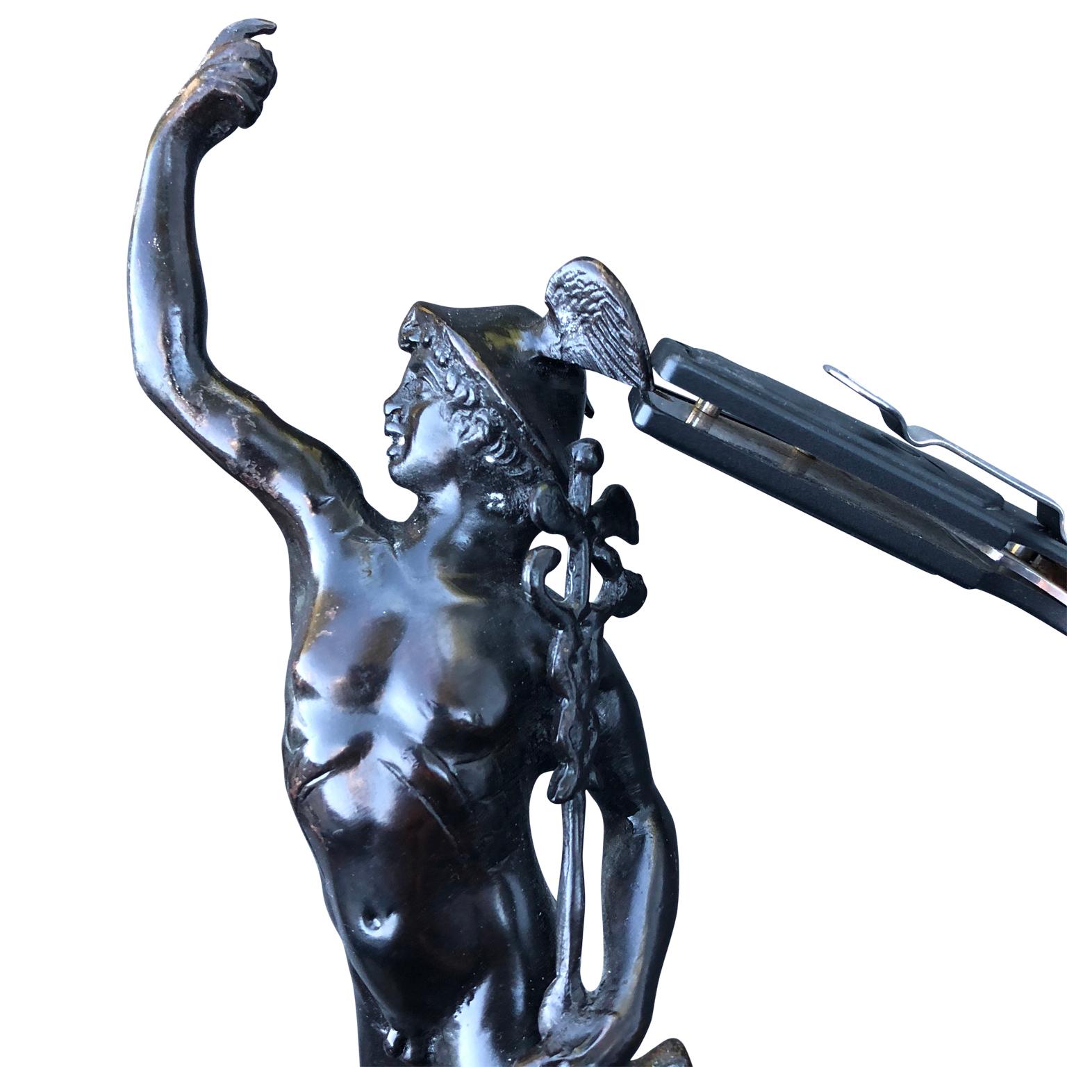 Early 20th century bronze sculpture of mercury on a marble stand.